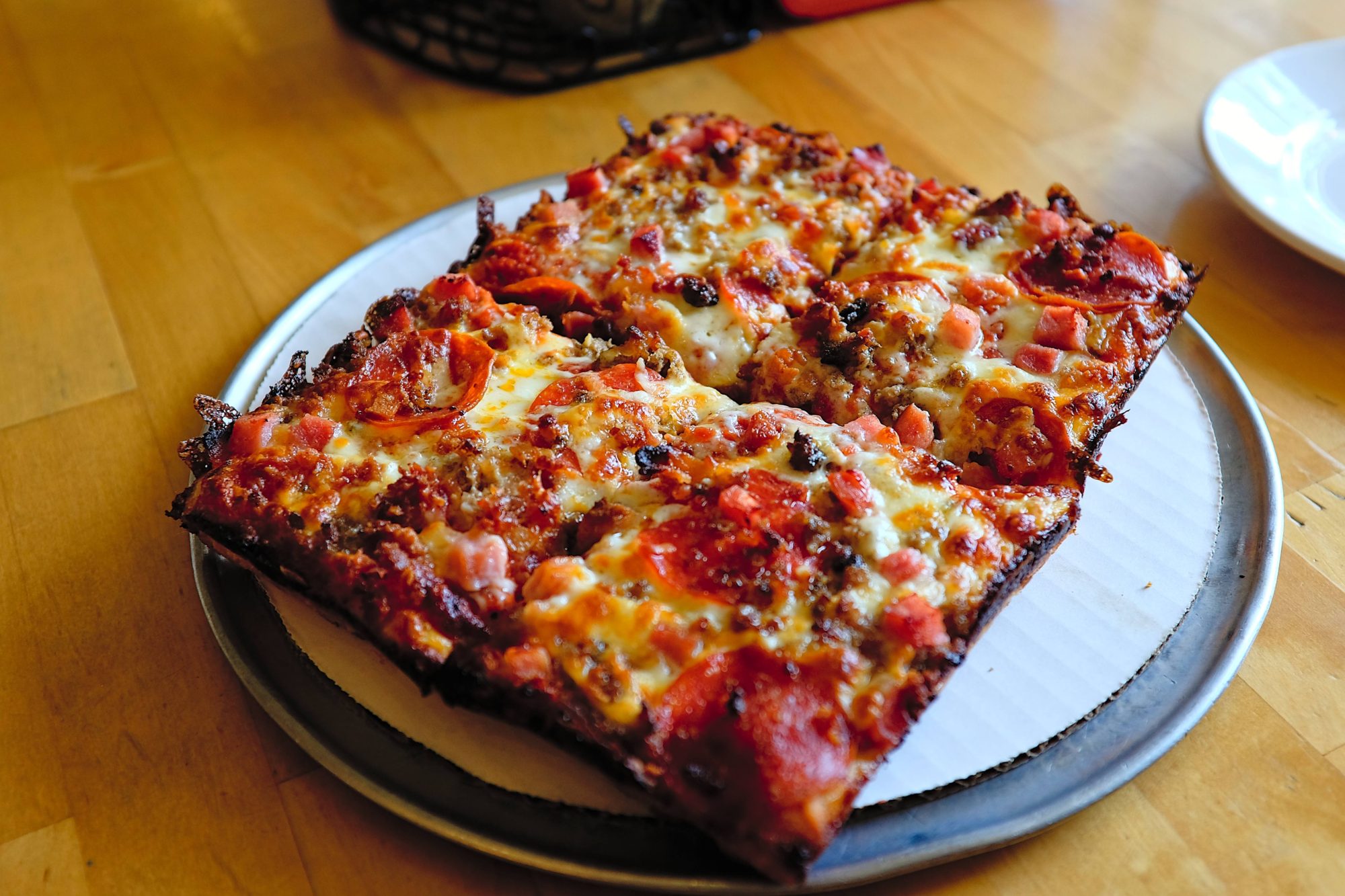 A Detroit pizza on a table