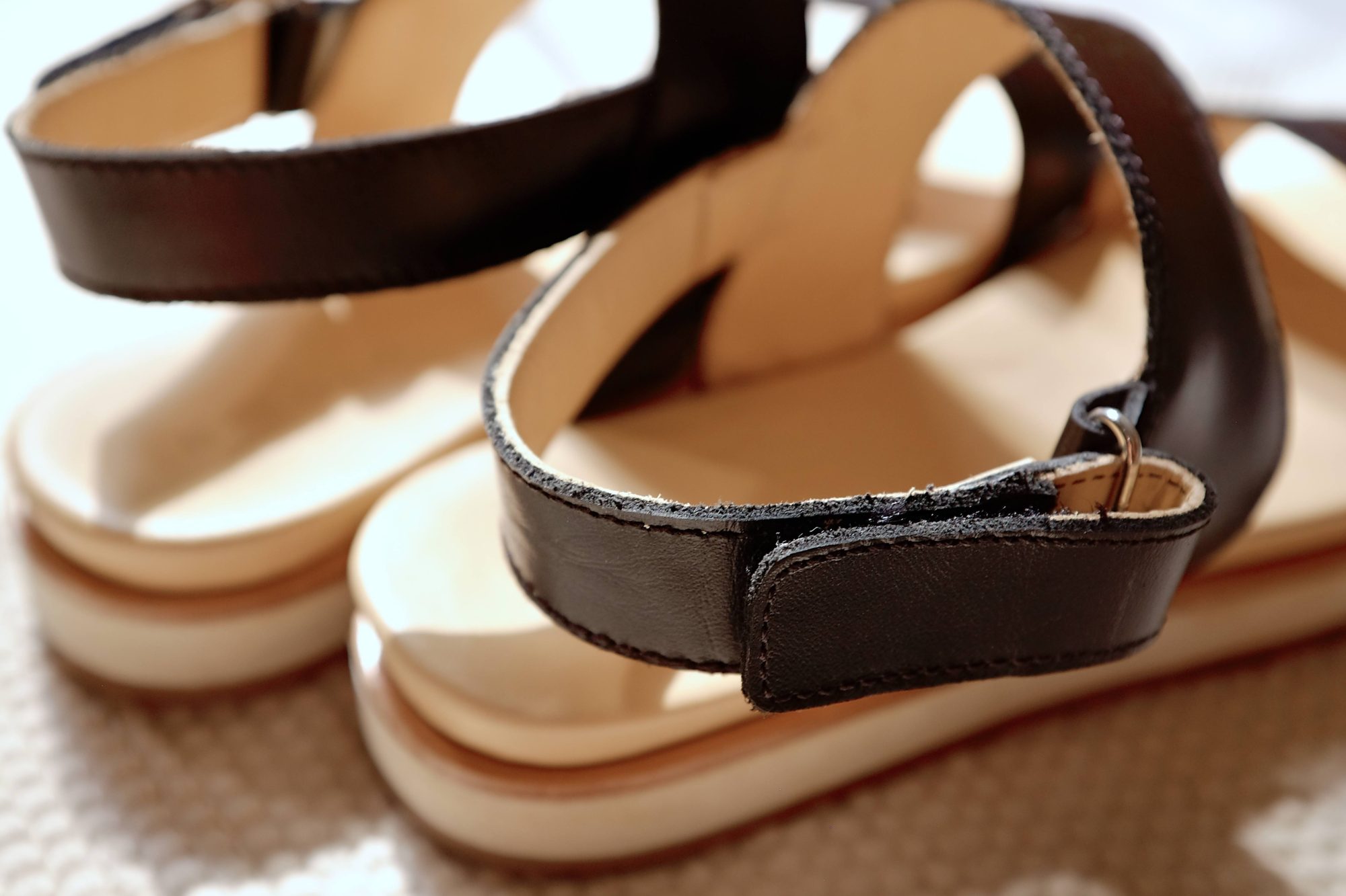 A close up of the Nisolo Flatform Sandal's closure