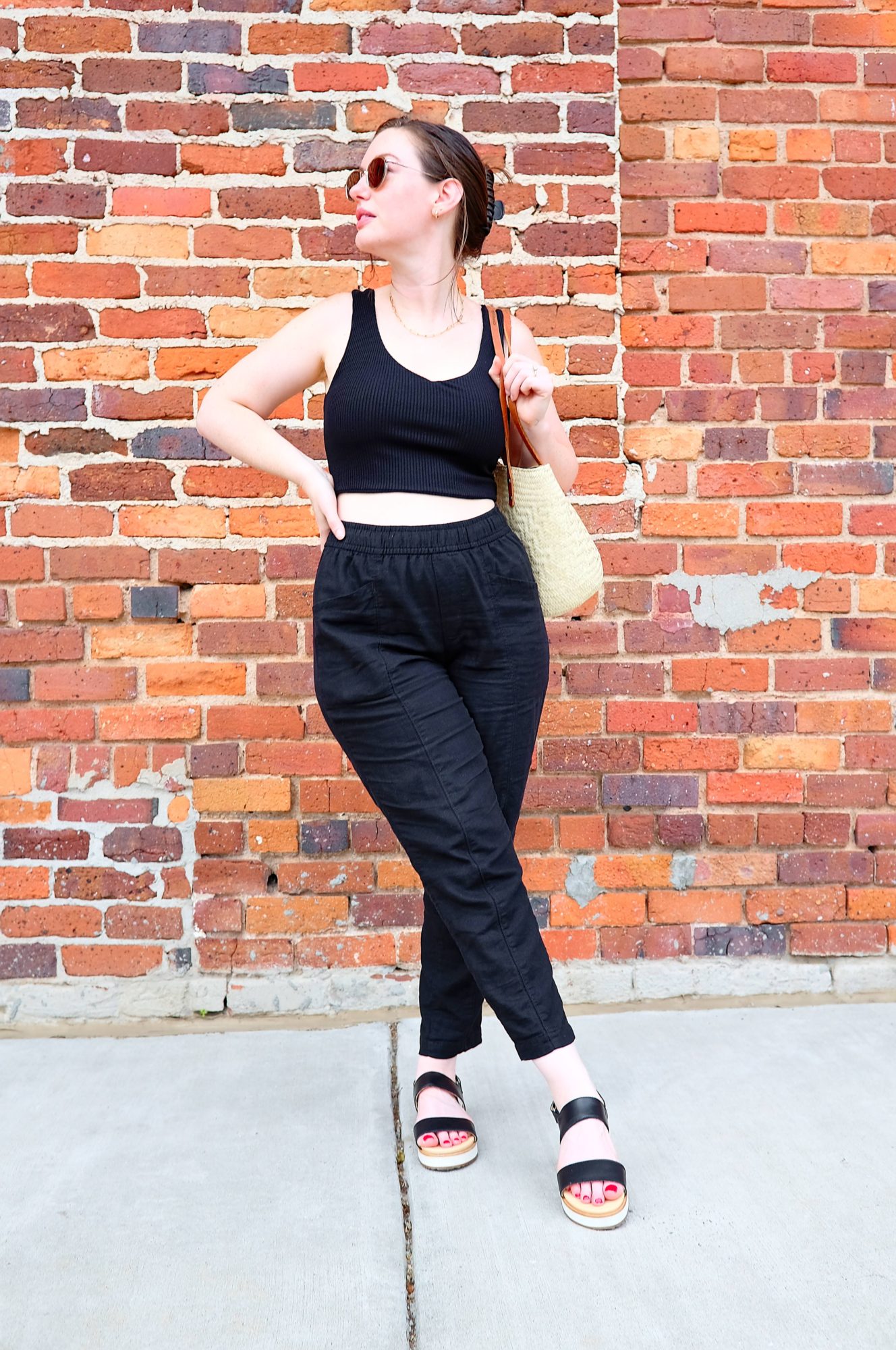 Alyssa stands with her ankles crossed while wearing the Flatforms