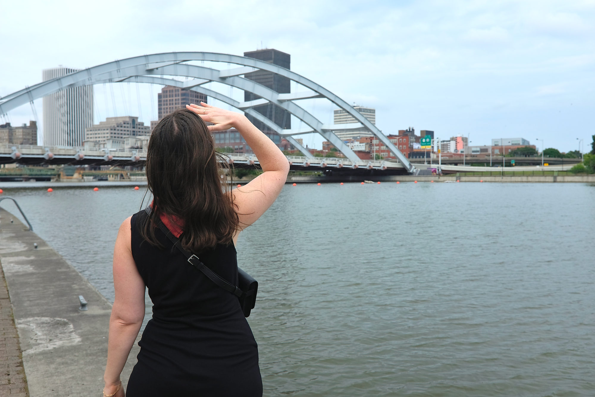 Alyssa looks out at the bridge in Rochester