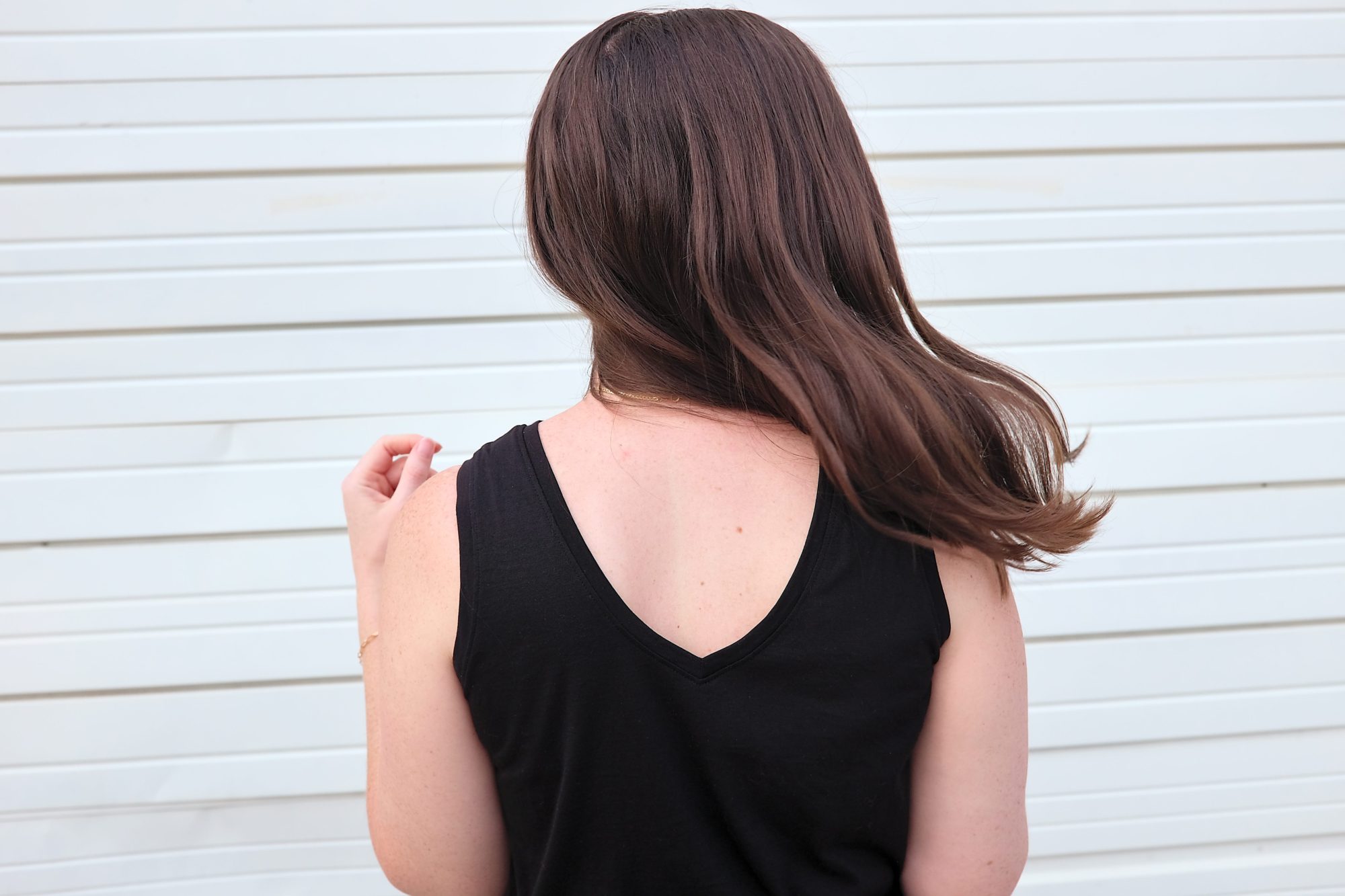 Alyssa wears the V in the back of the Poppy Tank