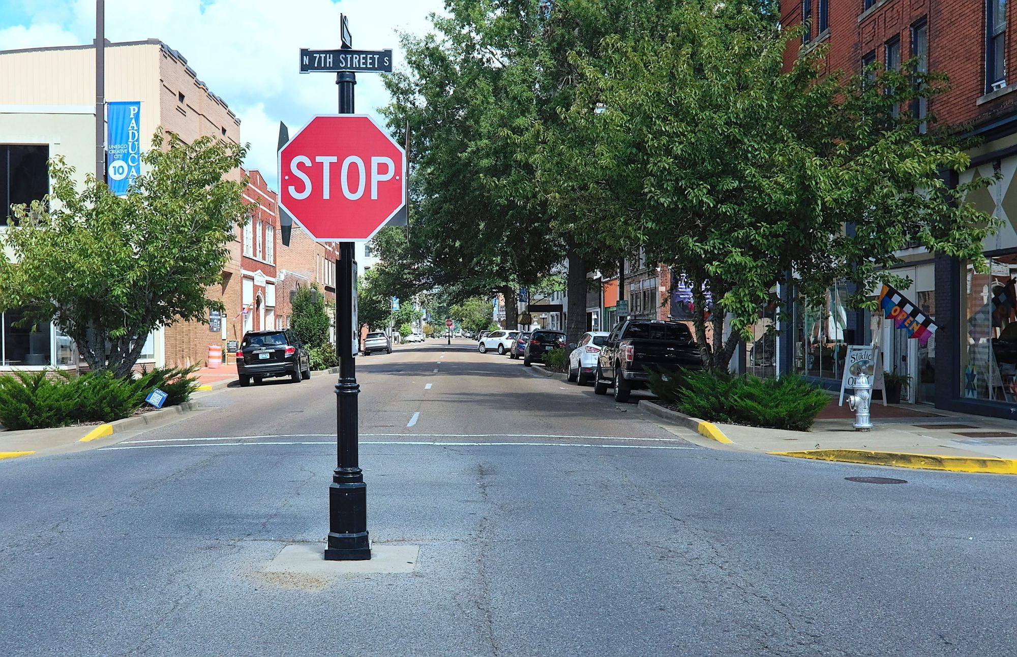 A shot of downtown Paducah with a stop sign in the foreground