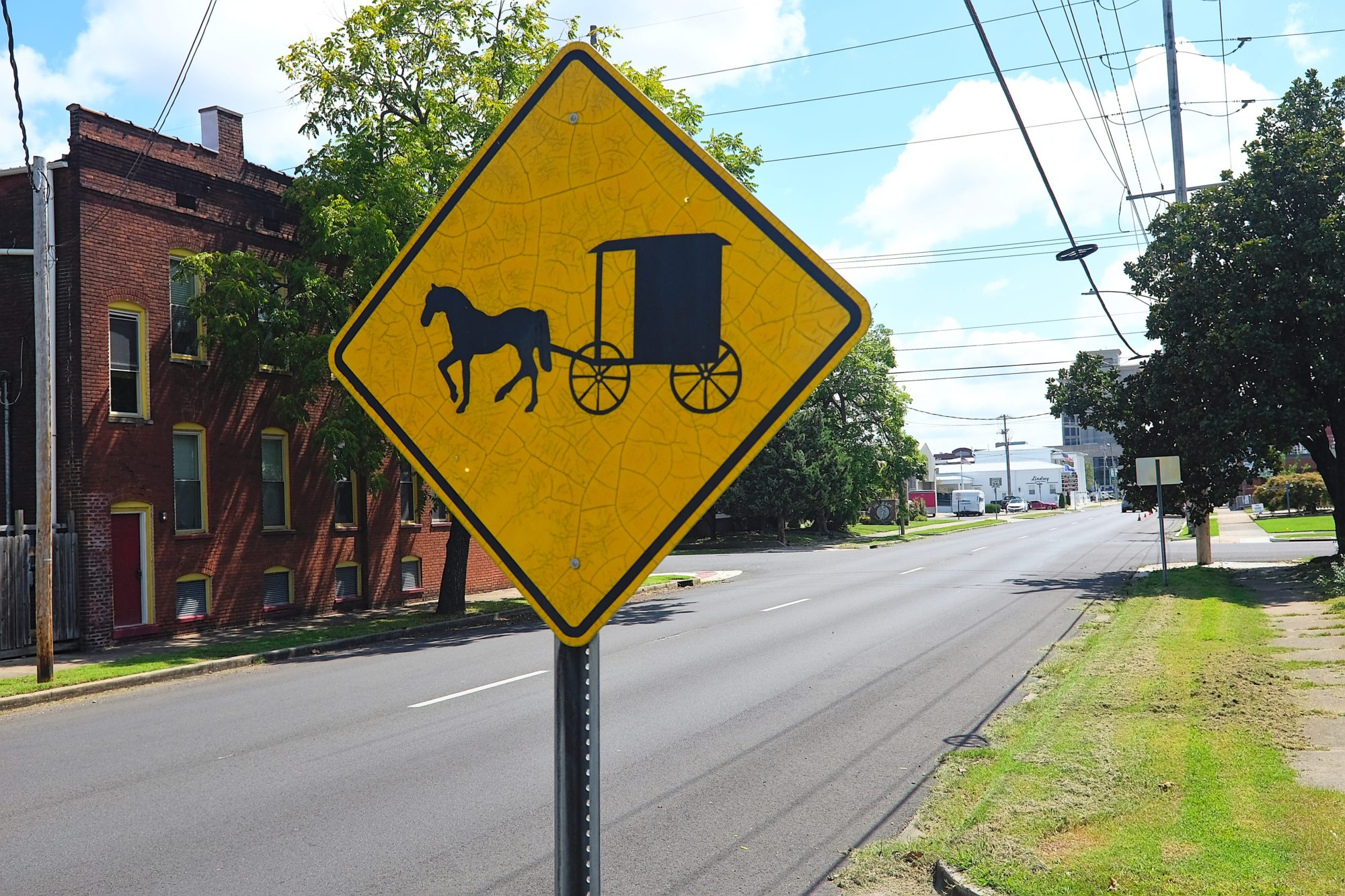 A sign for a horse and buggy crossing