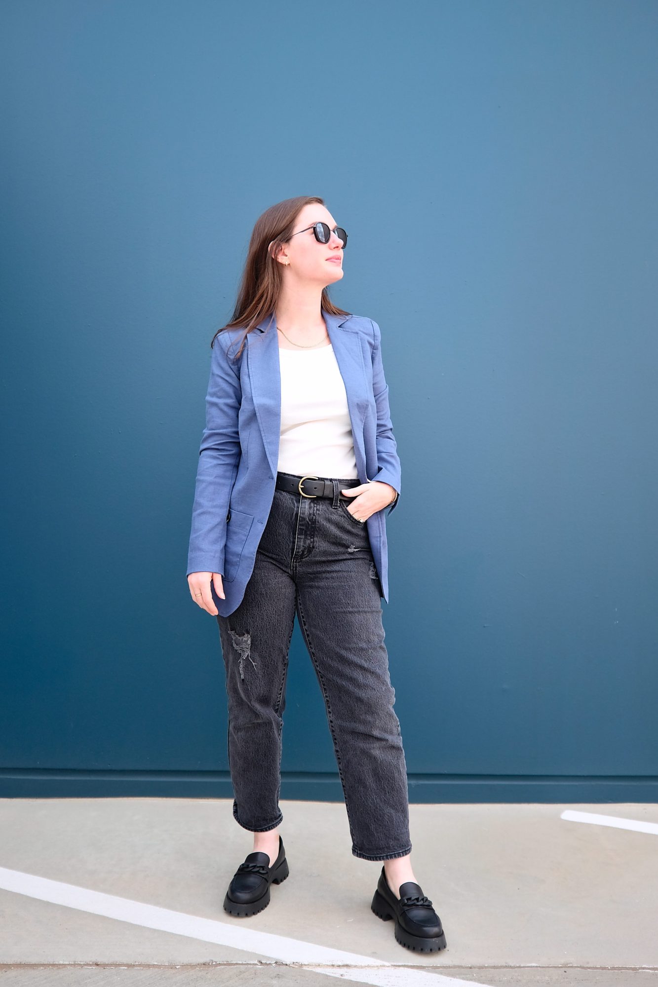 Alyssa wears a blue blazer with black denim