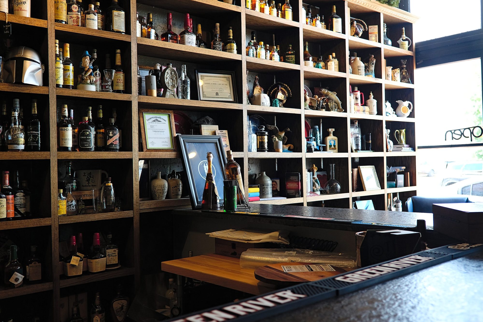 A wall of bourbon bottles at Barrel & Bond in Paducah