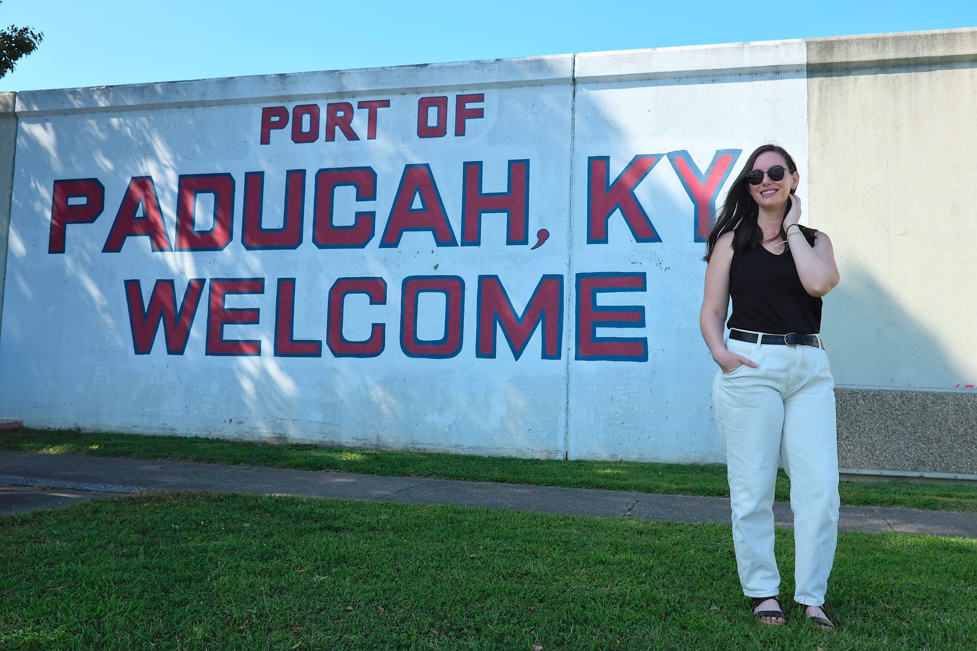 Alyssa stands in front of the Port of Paducah mural