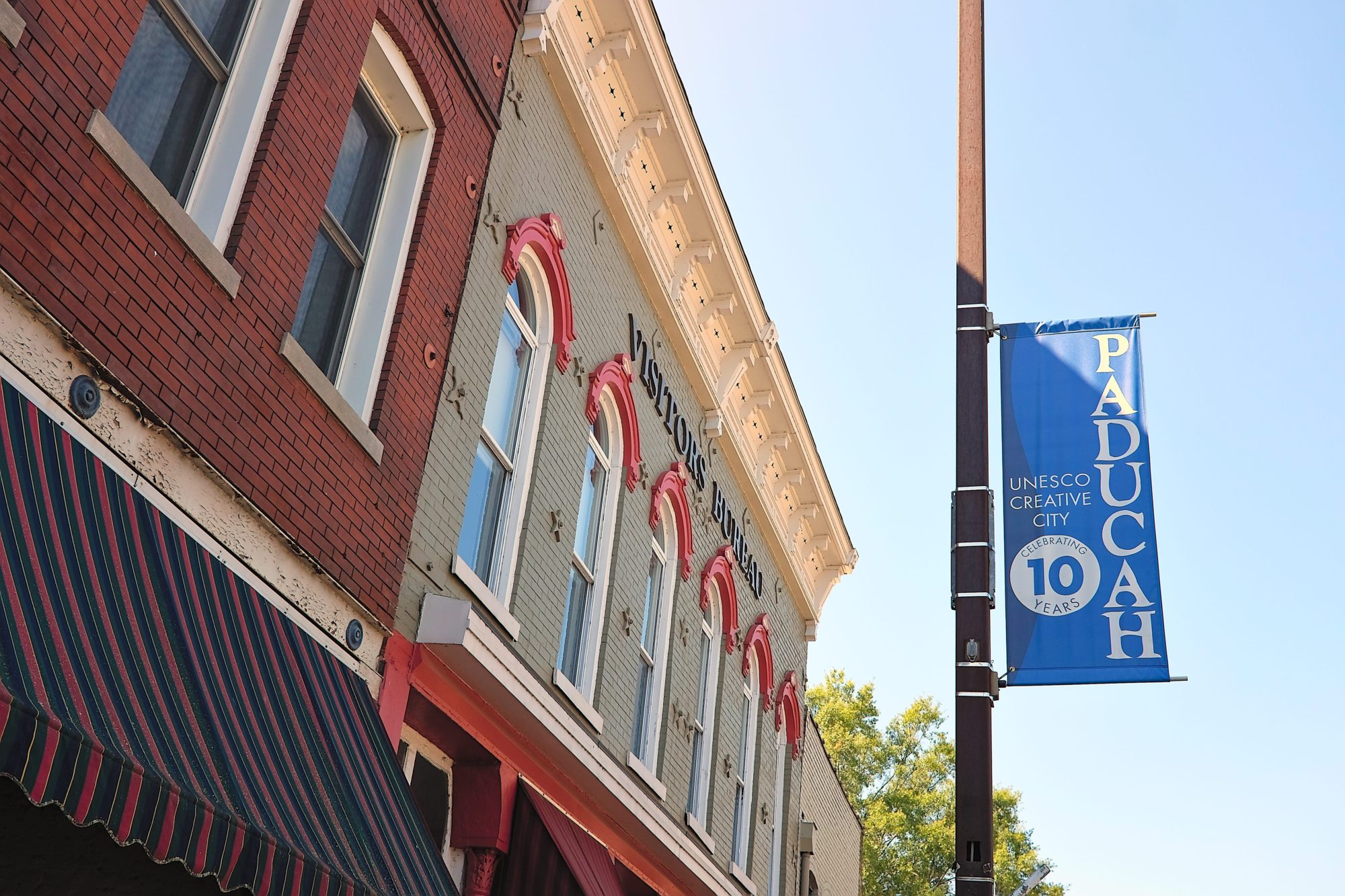 Image of the Paducah Visitors Bureau and a banner for 10 years as a UNESCO Creative City