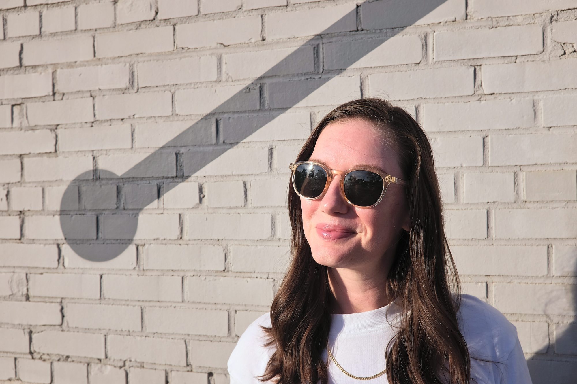 Alyssa wears a pair of clear Sunski sunglasses to share her review