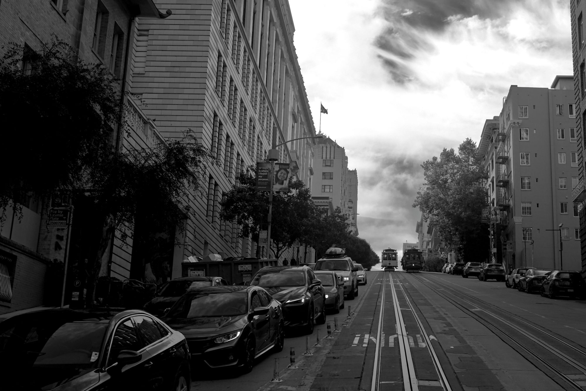 A black and white shot of a trolley in San Francisco