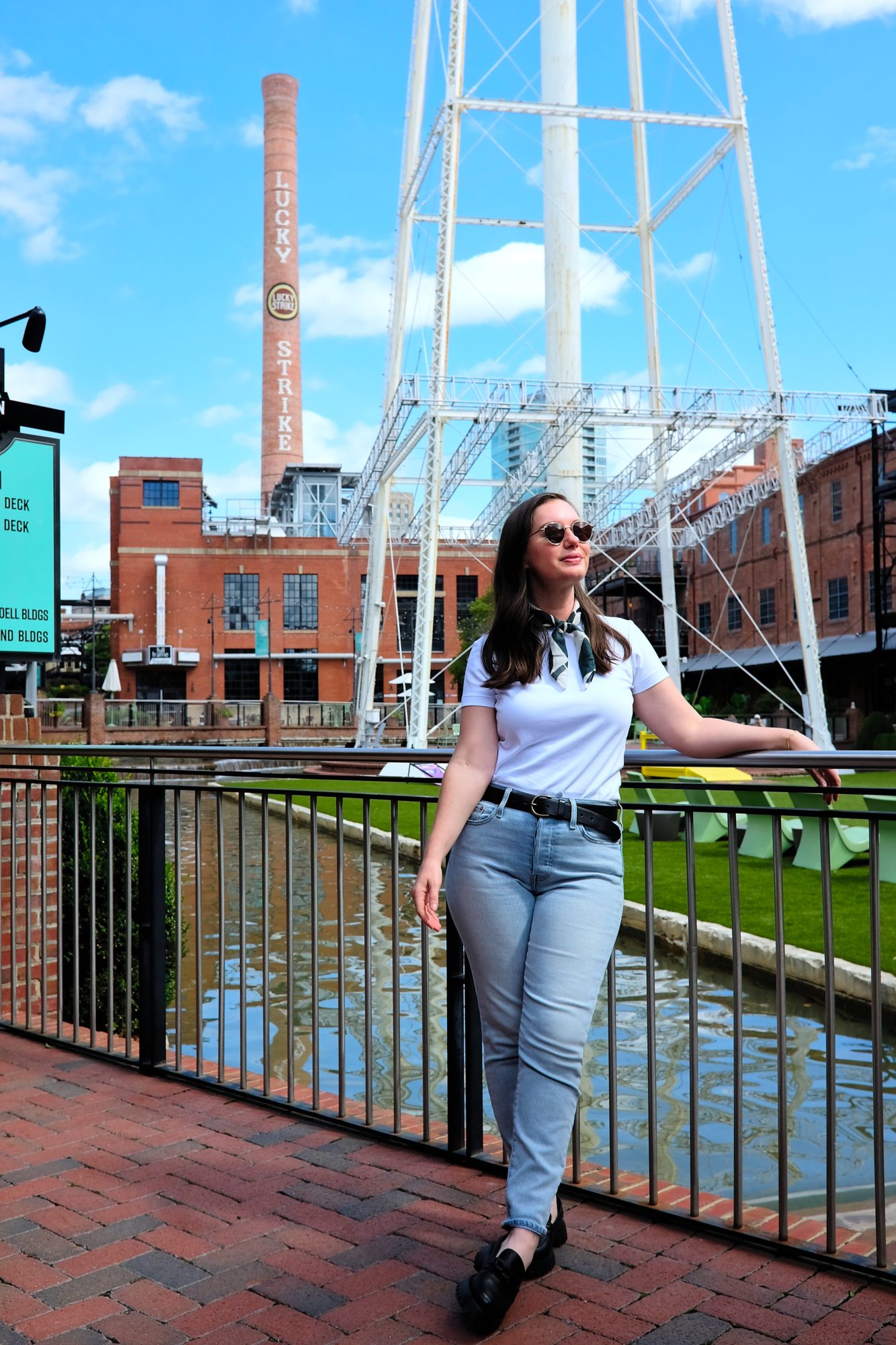 Alyssa wears a white tee and jeans at the American Tobacco Campus