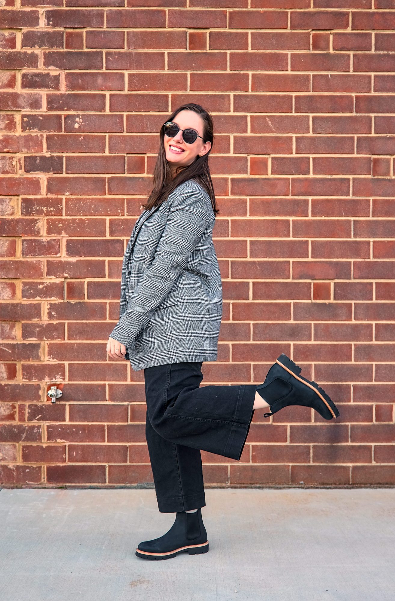 Alyssa wears the Go-To Lug Chelsea Boot with a plaid blazer and black pants