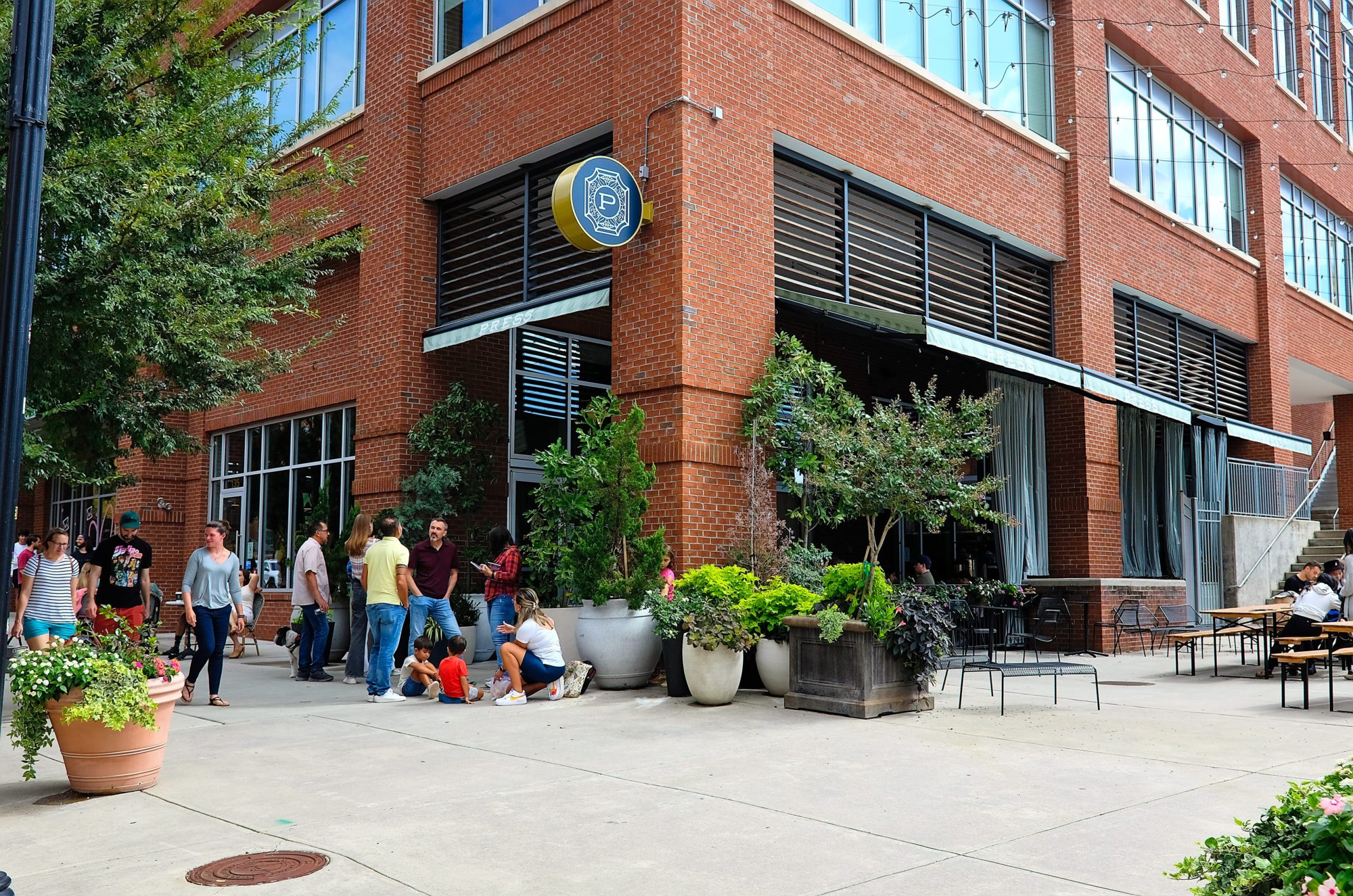 A crowd waits at PRESS Coffee Crêpes Cocktails