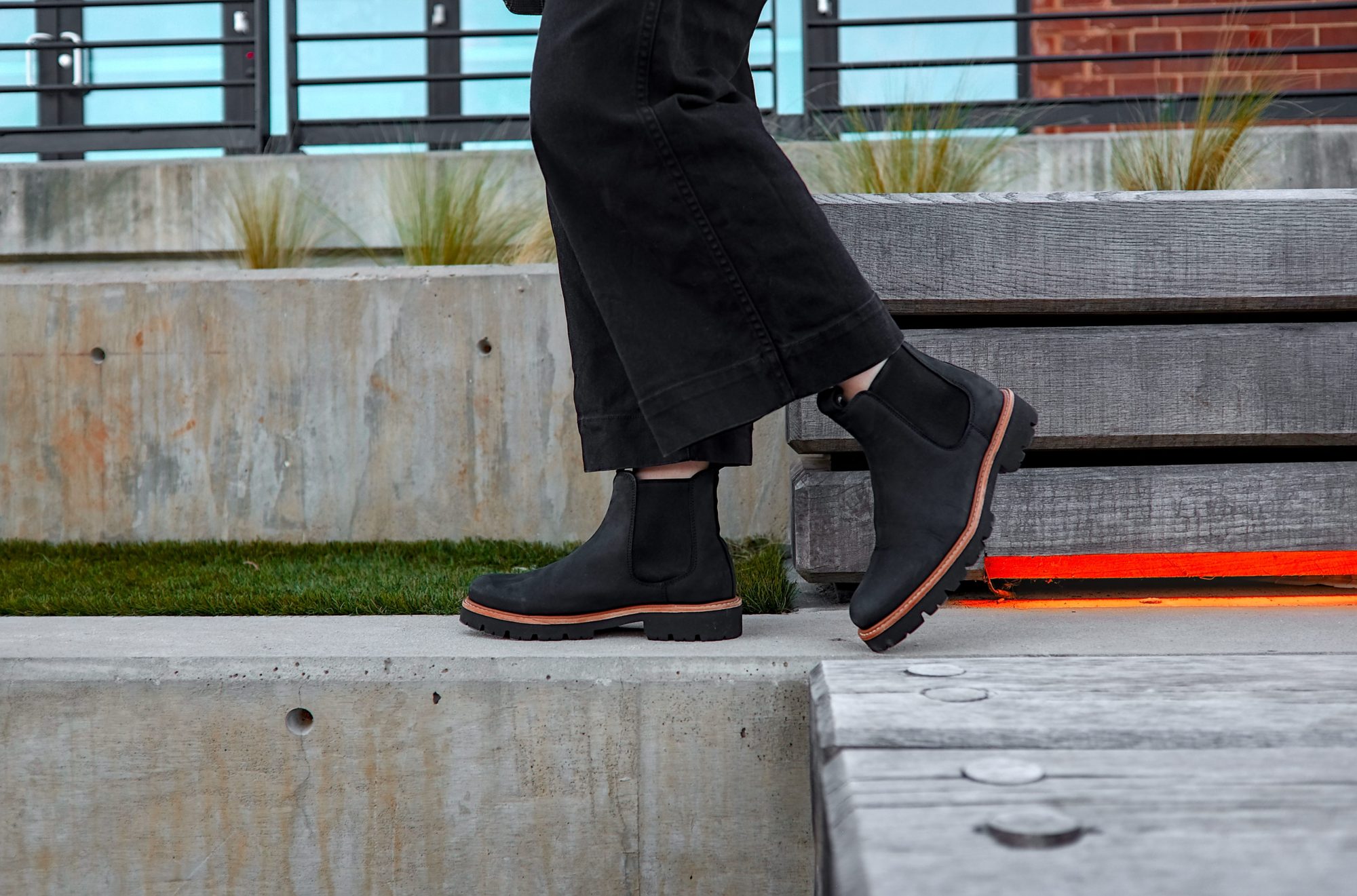 Alyssa walks in the Nisolo Go-To Lugsole Boots