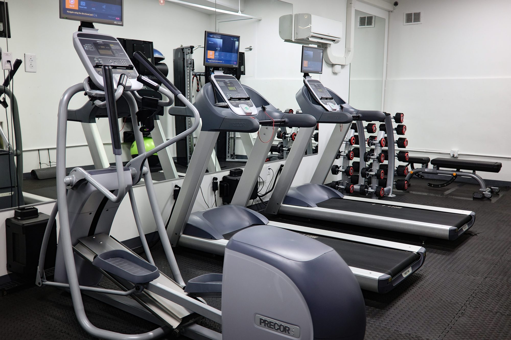 A fitness center with several exercise machines