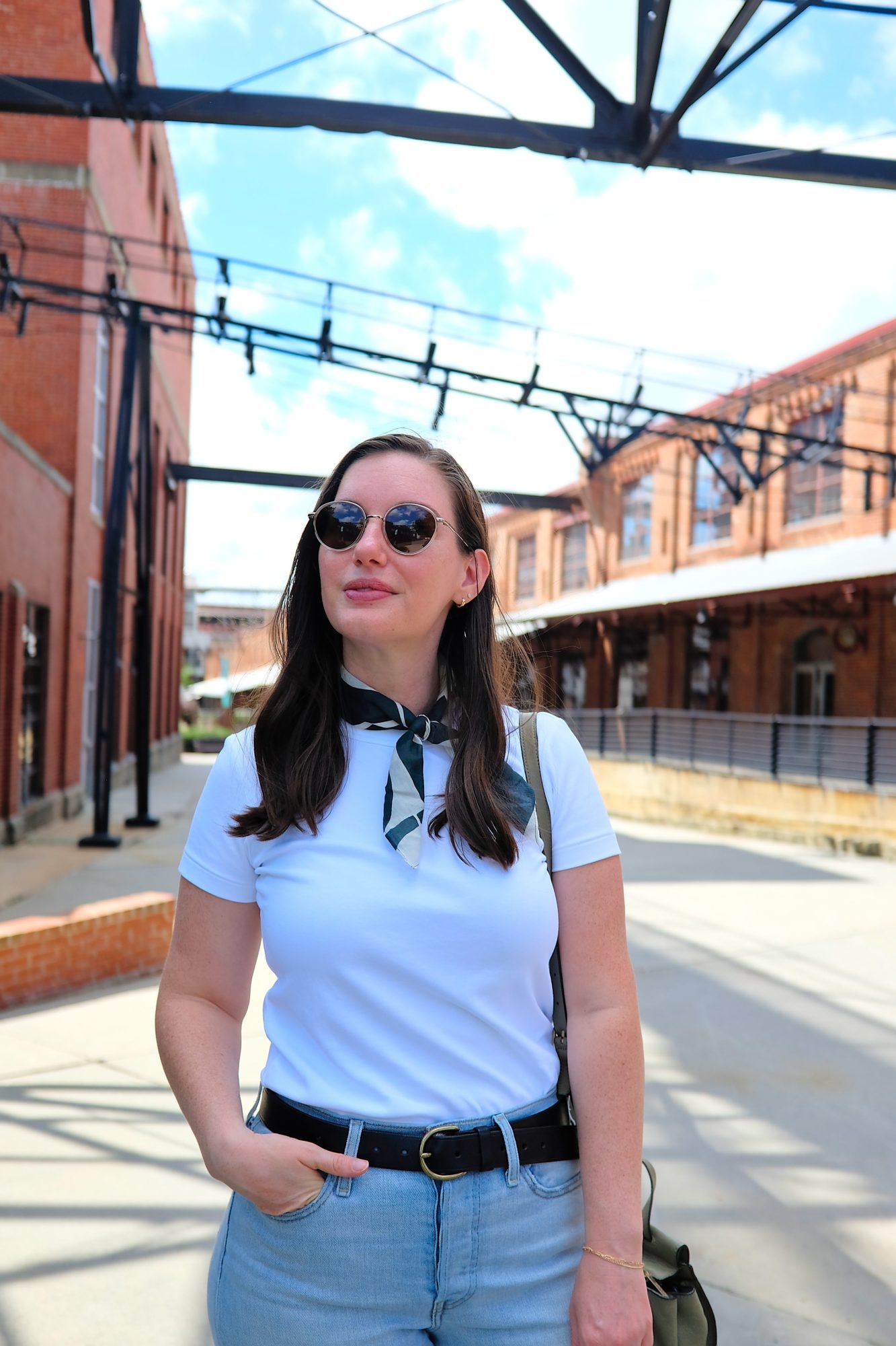 Alyssa walks around the ATC in Durham in a white tee and jeans