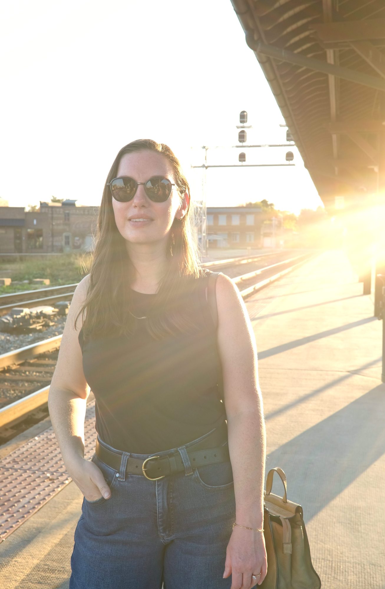 Alyssa stands on the platform at the Salisbury station