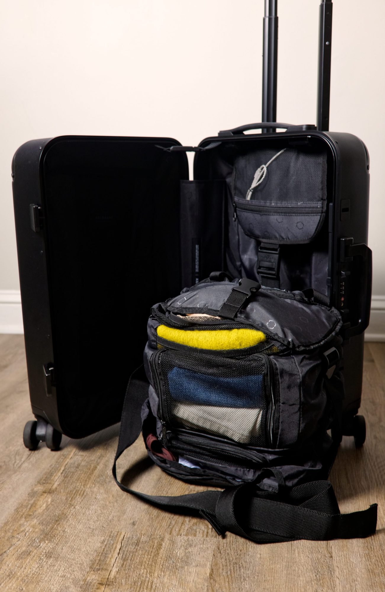 The Solgaard Carry-On Closet with a packed and condensed closet