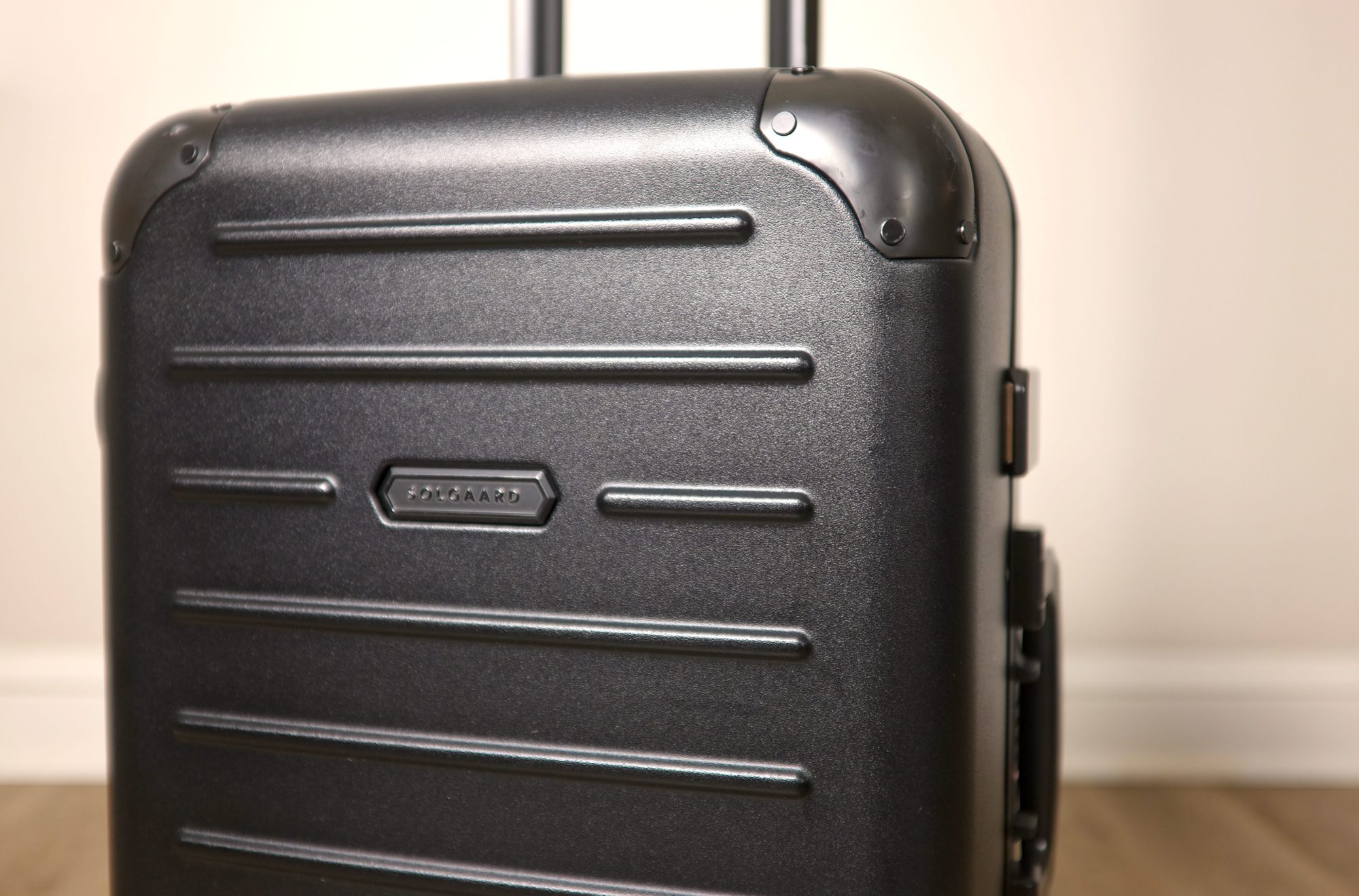 A suitcase with a Solgaard logo