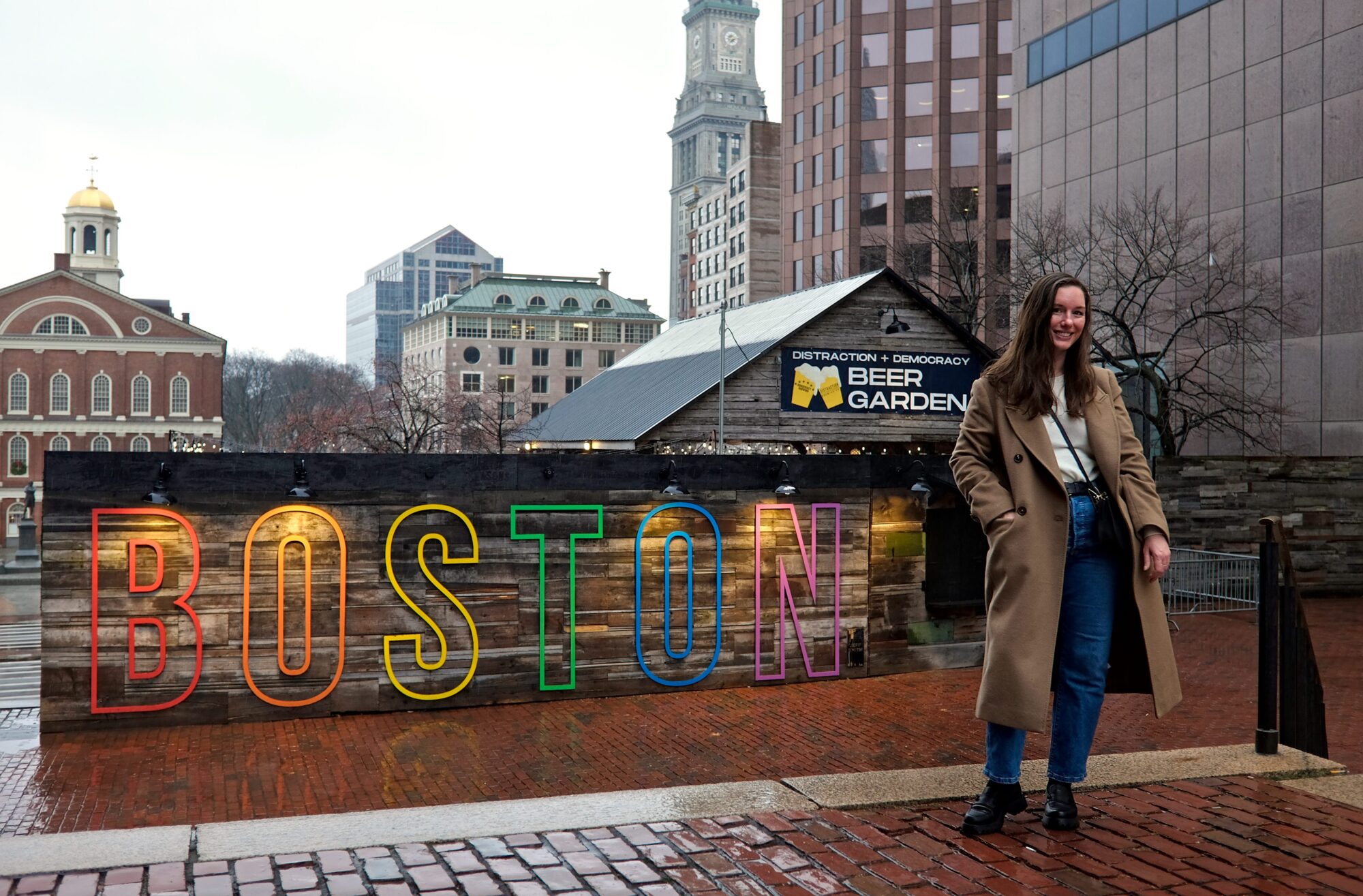 Alyssa stands in front of a BOSTON sign