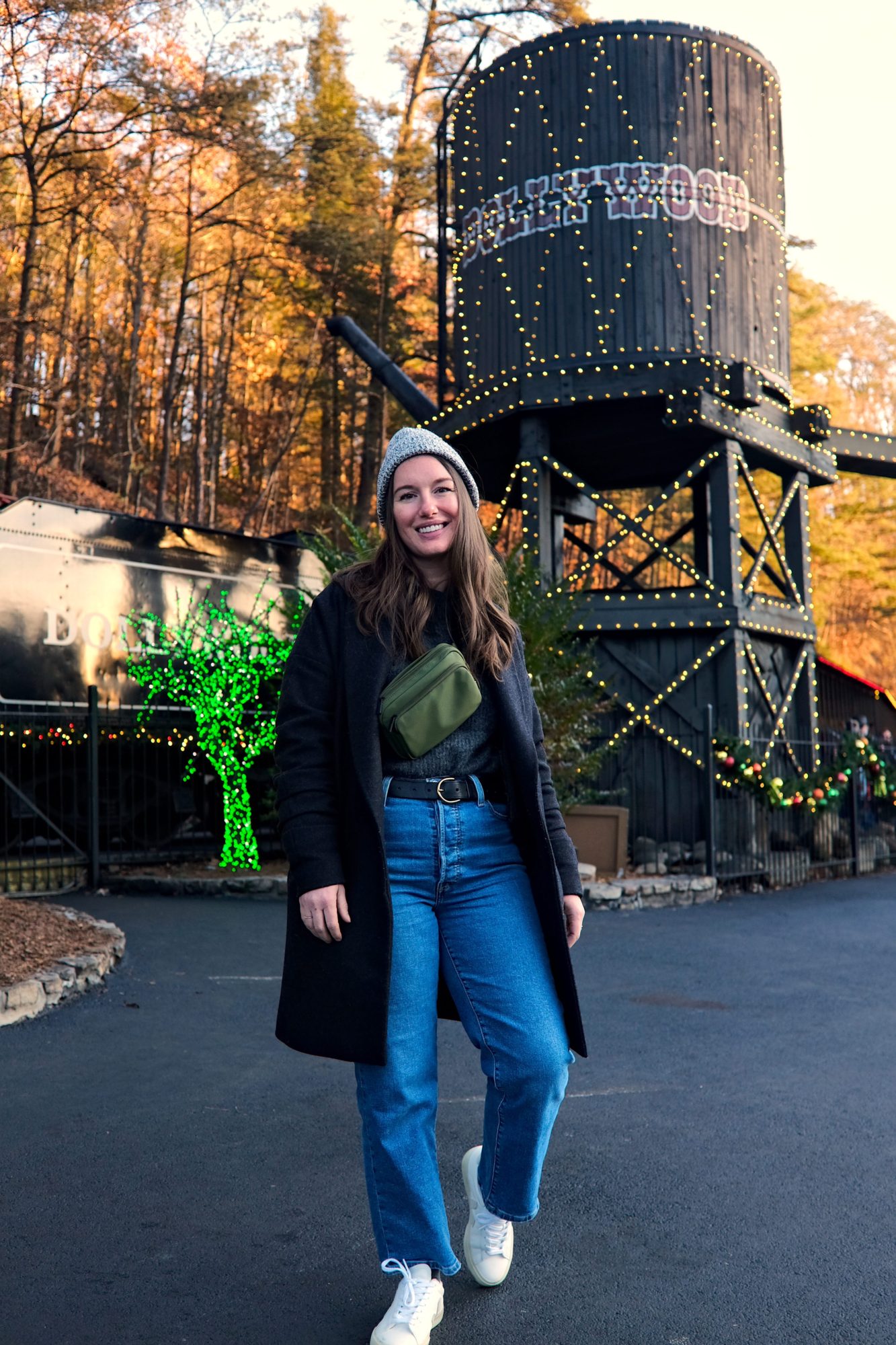 Alyssa walks in front of the train boarding area at Dollywood