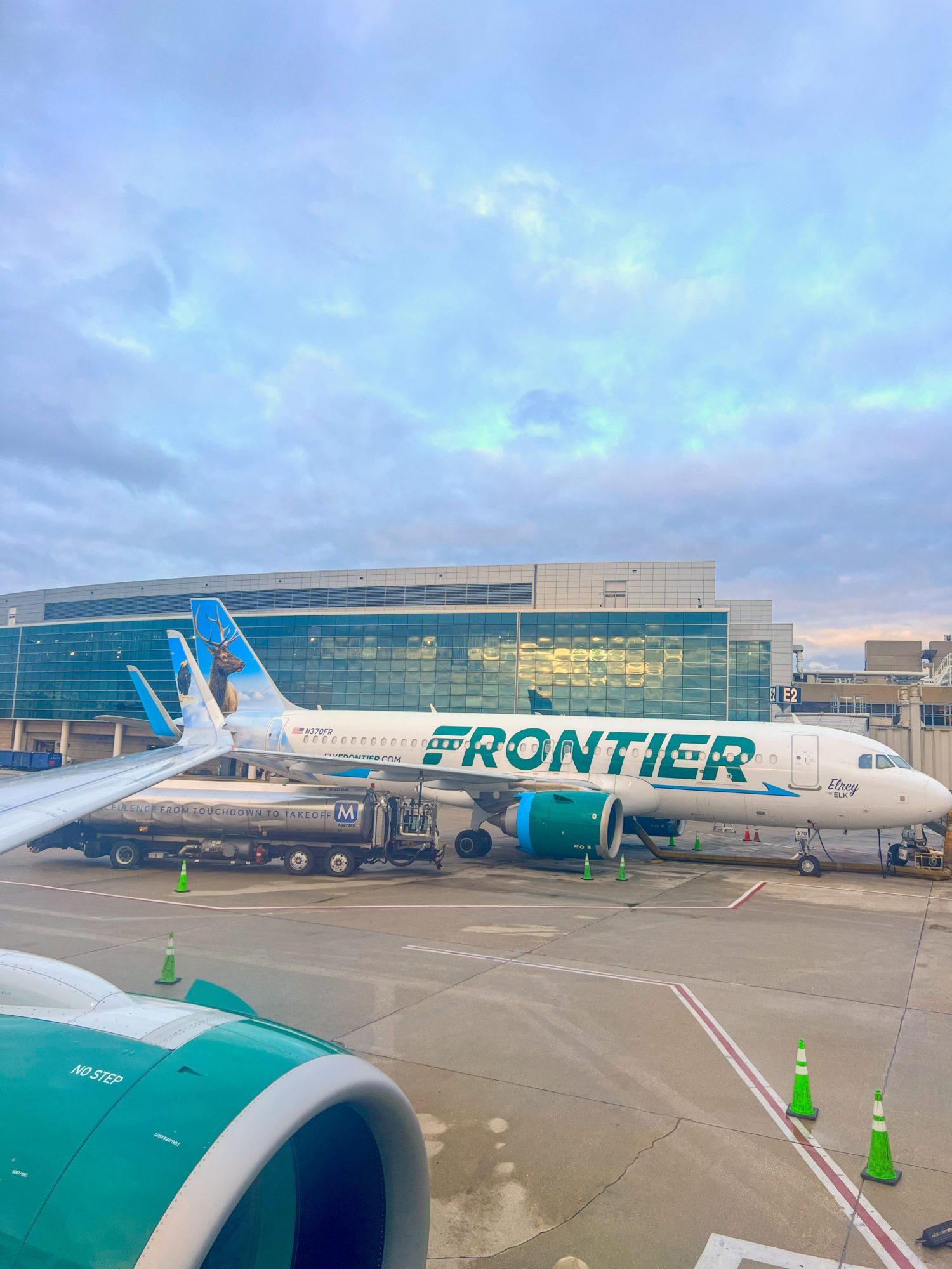 A view of a Frontier plane from the window of a Frontier plane