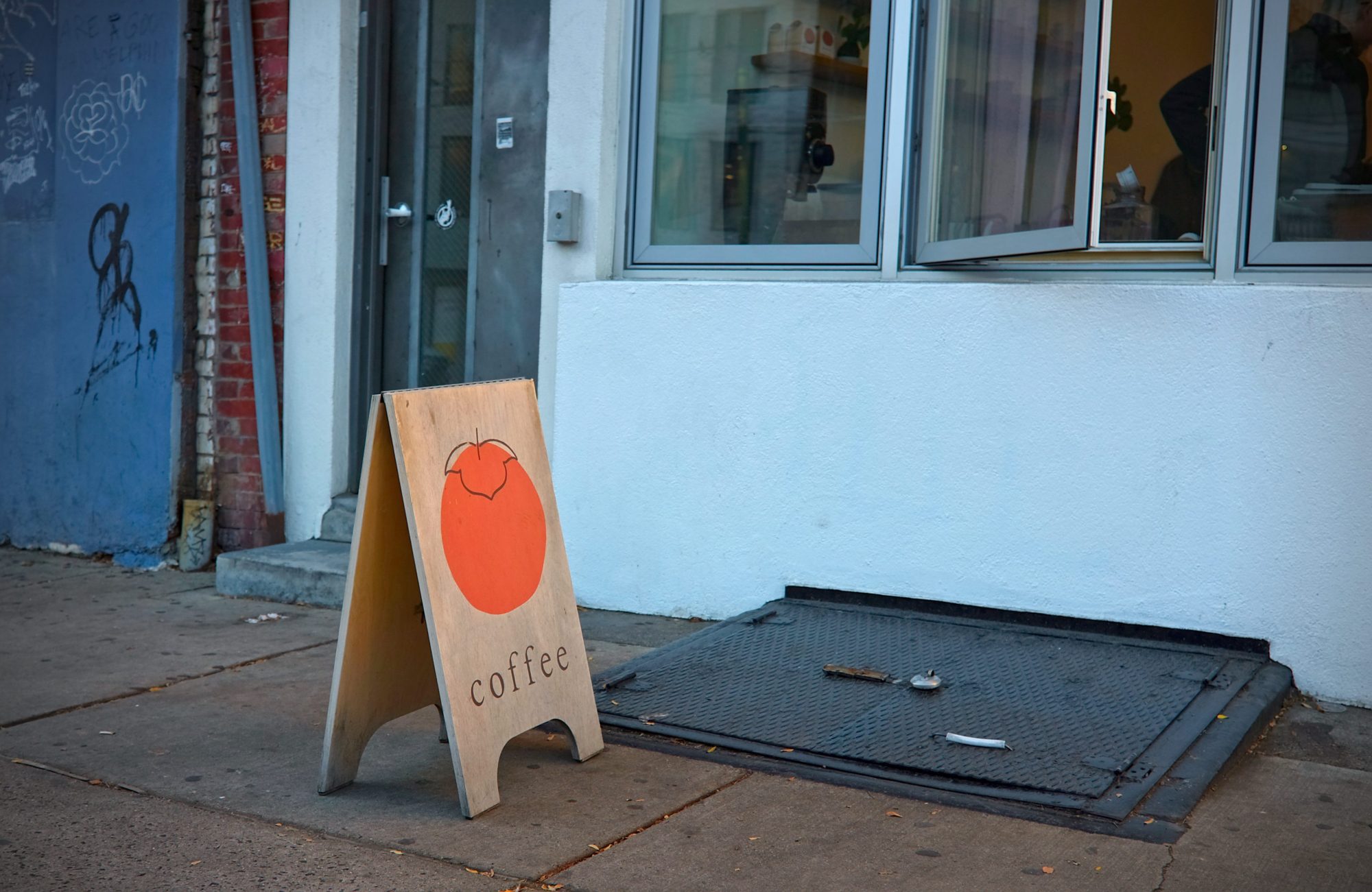A sign for Persimmon Coffee in Philadelphia