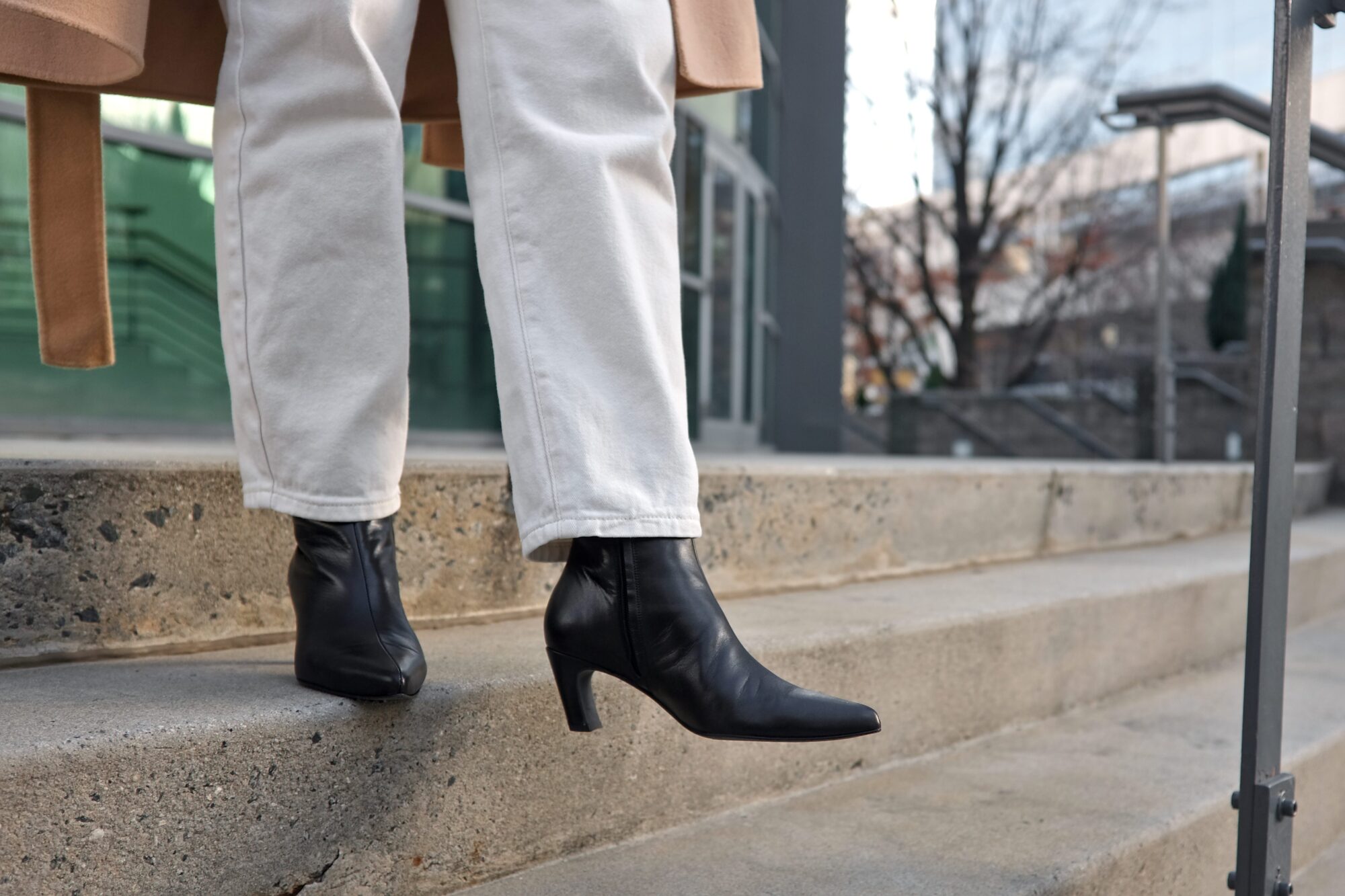 Alyssa descends the stairs in the boots from Poppy Barley