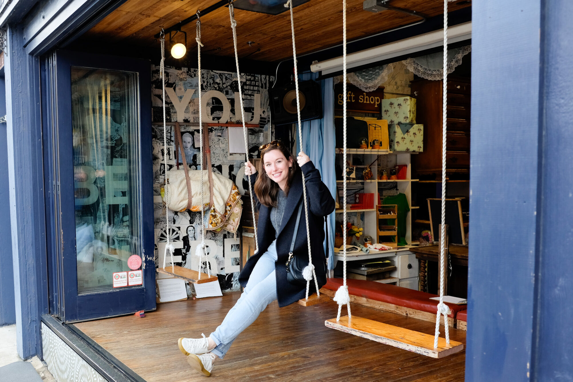 Alyssa swings on a swing at Elsewhere