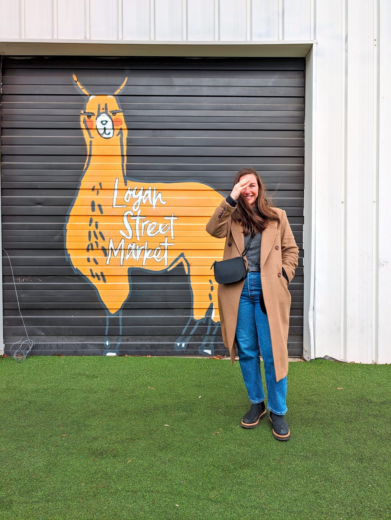 Alyssa stands outside the Logan Street Market in Louisville