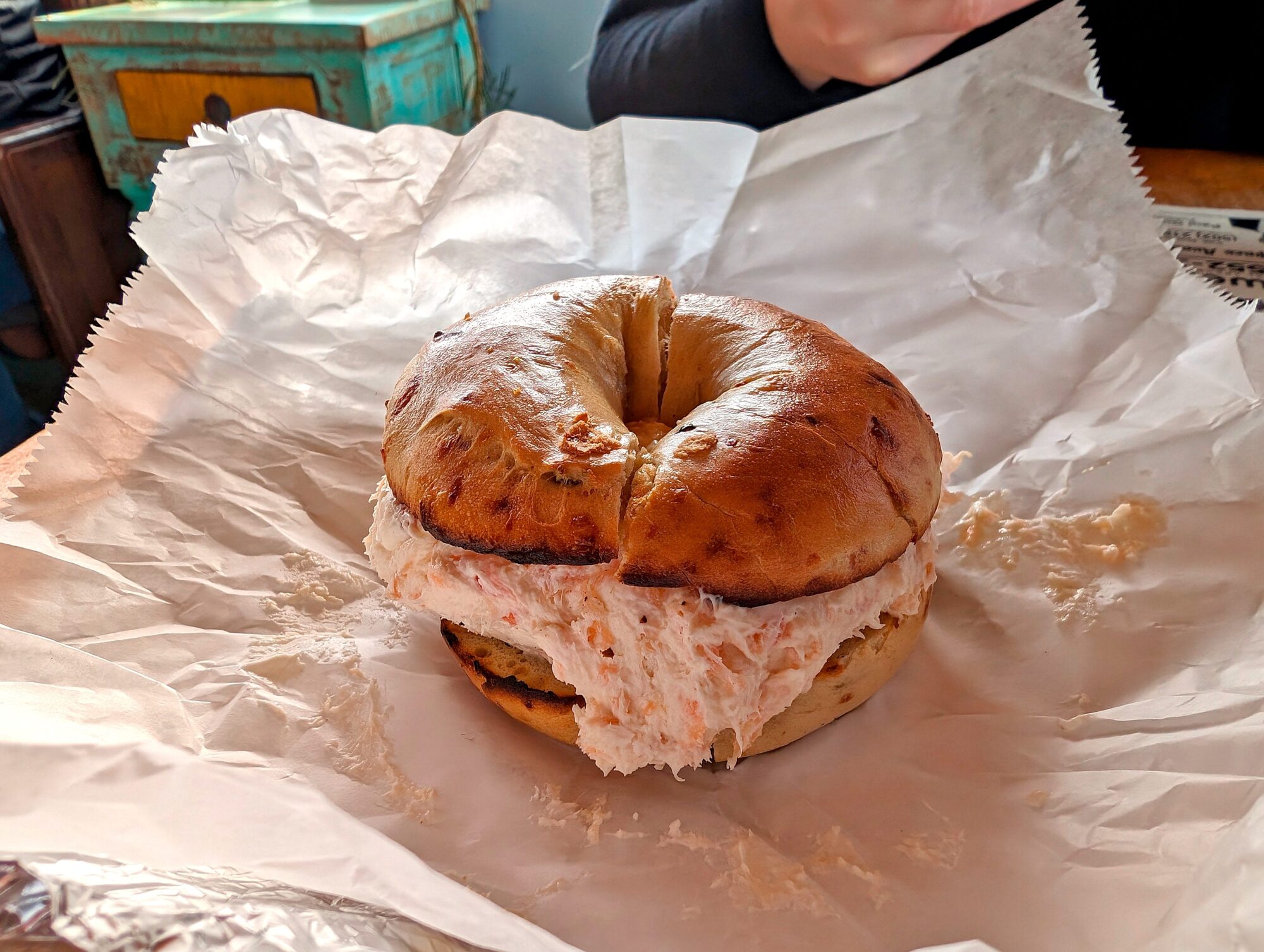 A bagel with cream cheese at Payne Street Bake House