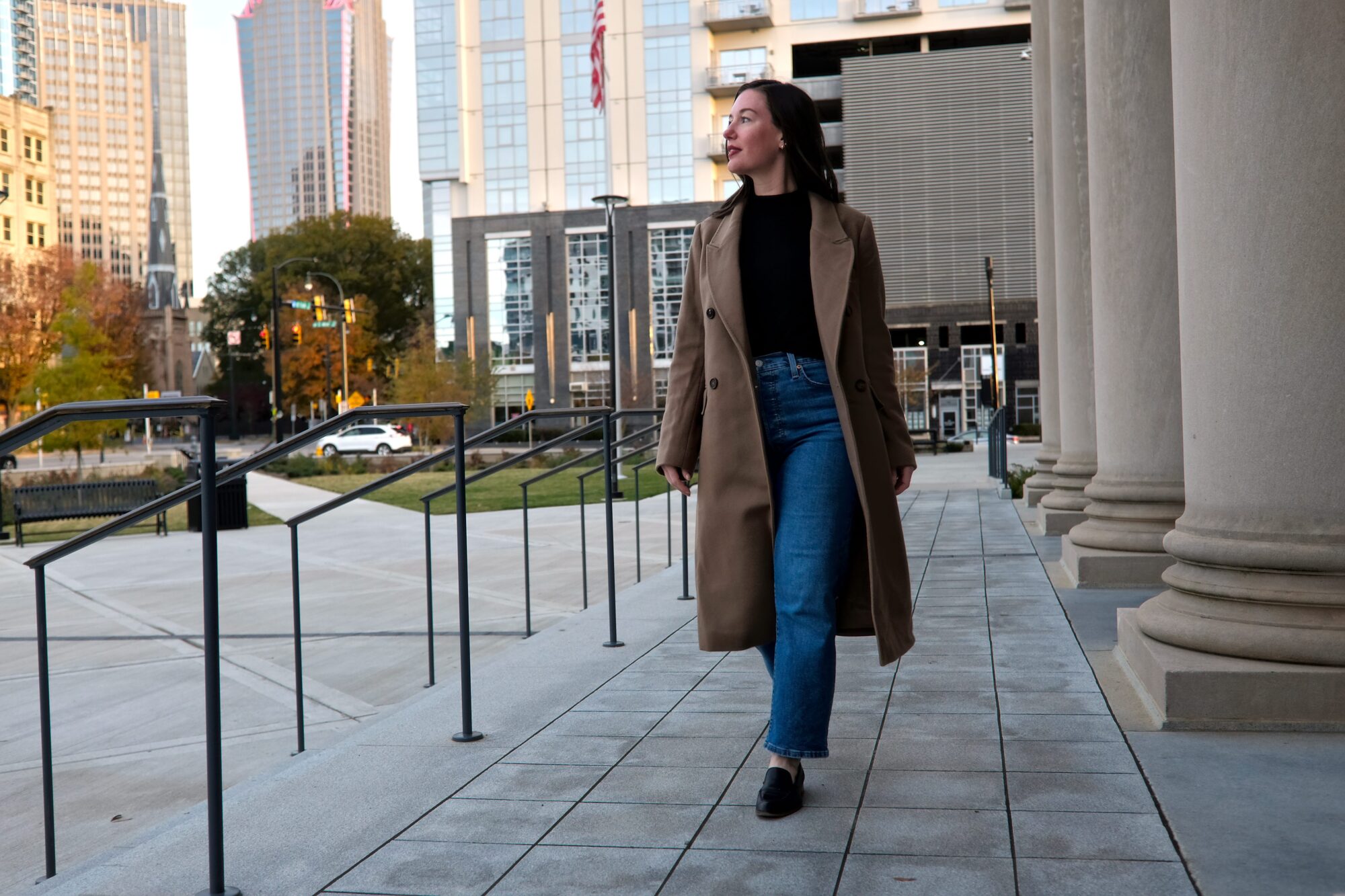 Alyssa wears the Quince Wool Coat and walks toward the camera