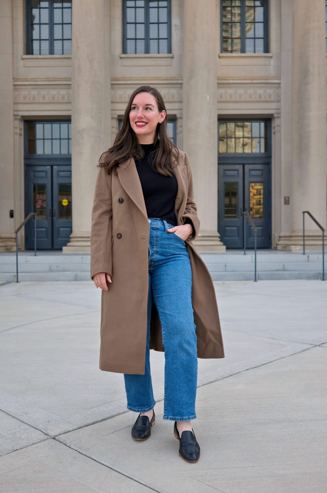Alyssa wears the Italian Wool Double-Breasted Coat with jeans and a black top