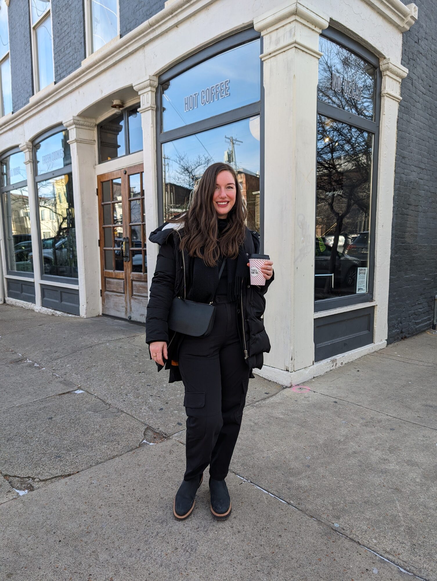 Alyssa stands in front of Please & Thank You in Louisville