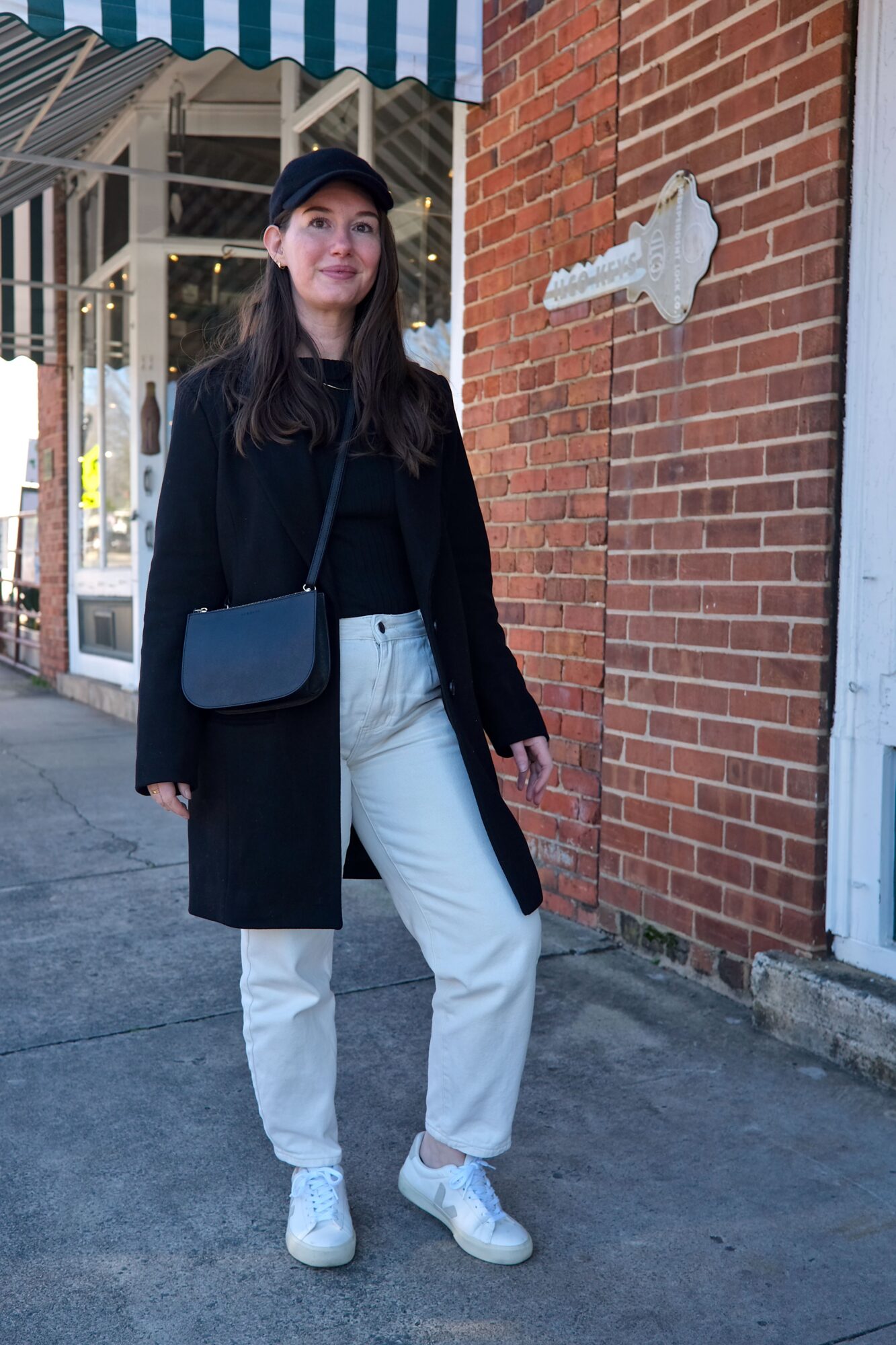 Alyssa stands in front of the hardware store in Matthews