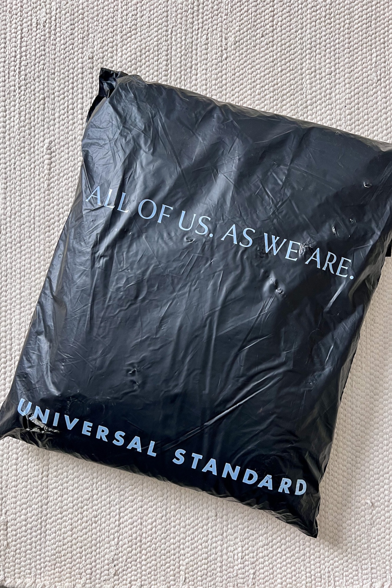 A Universal Standard shipper bag