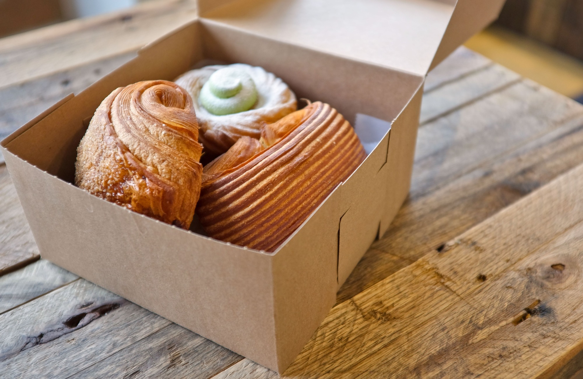 A box of croissant pastries from a Charlotte bakery