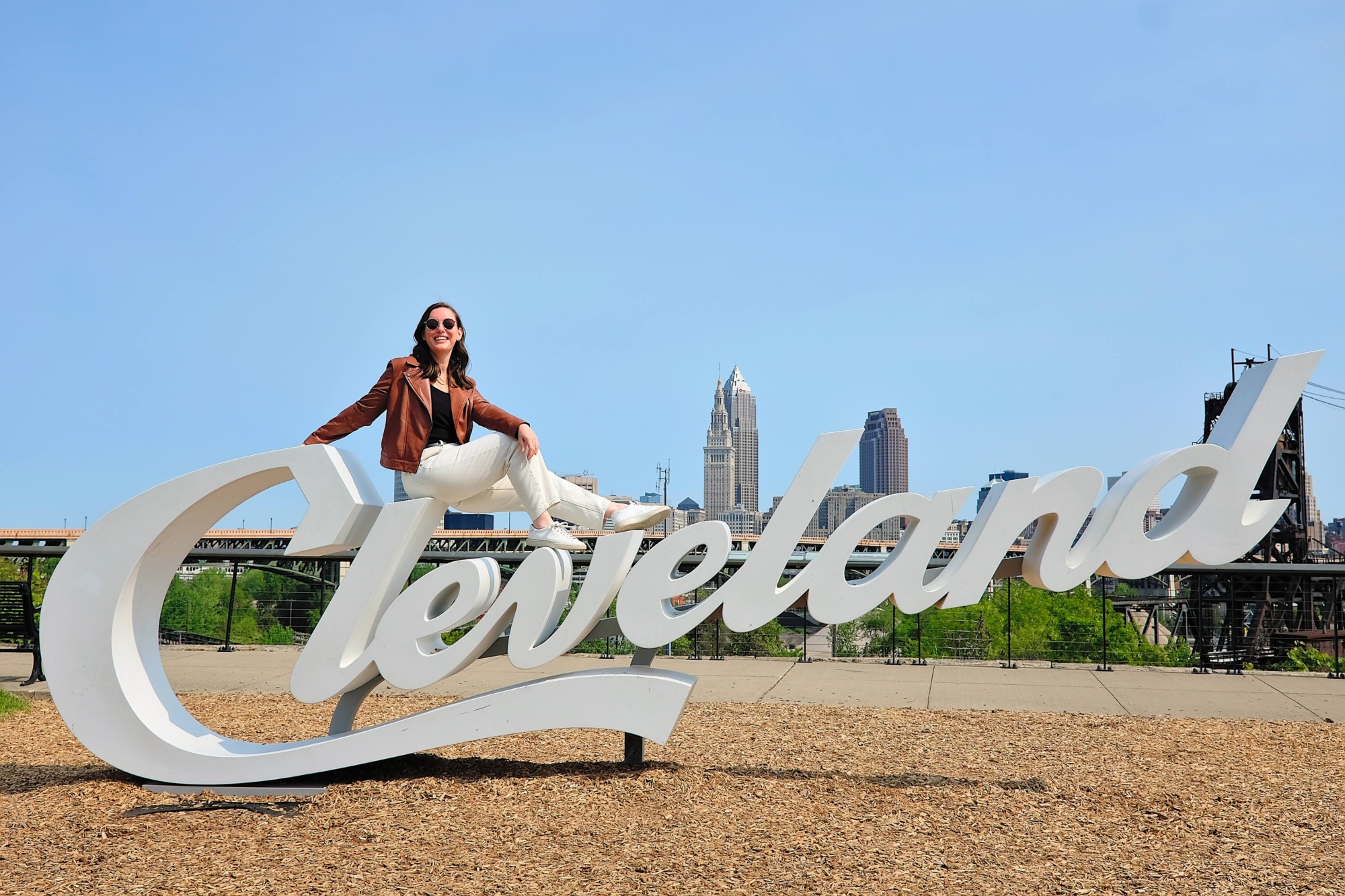 Alyssa sits on the Cleveland sign
