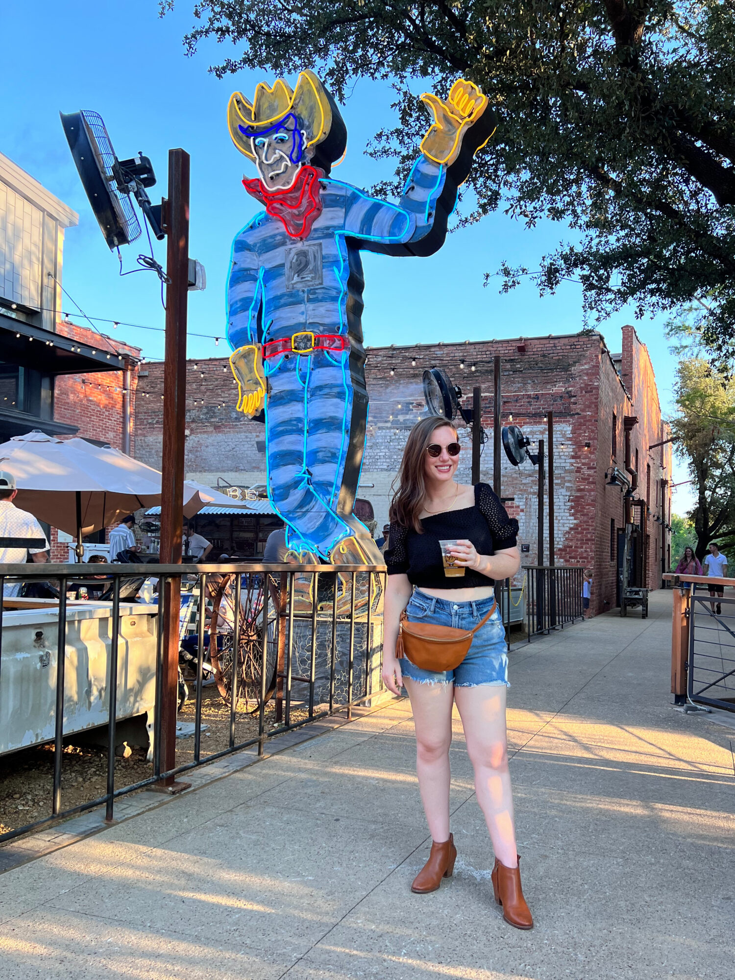 Alyssa stands outside of a brewery in Fort Worth