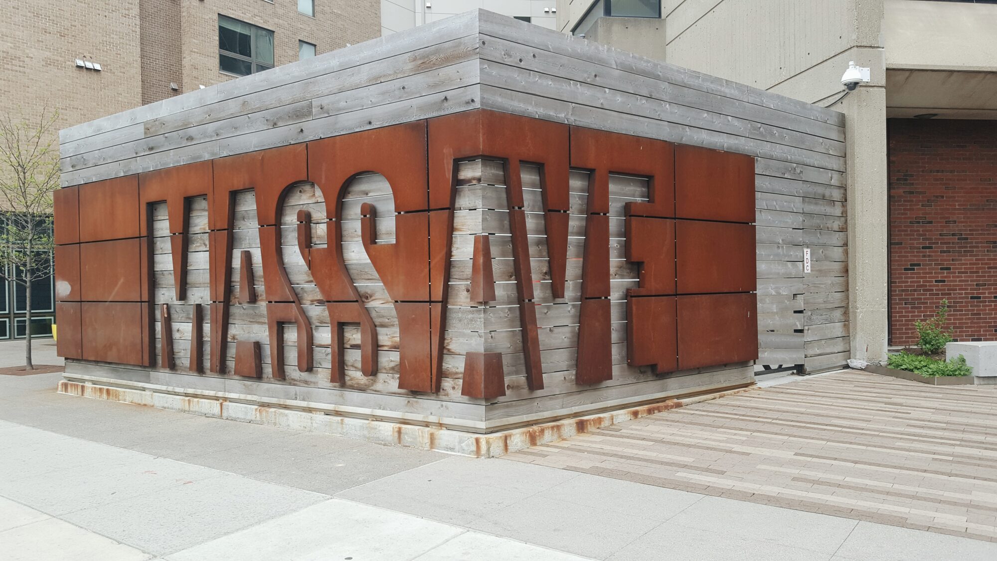 A large wraparound sign reads "MASS AVE"