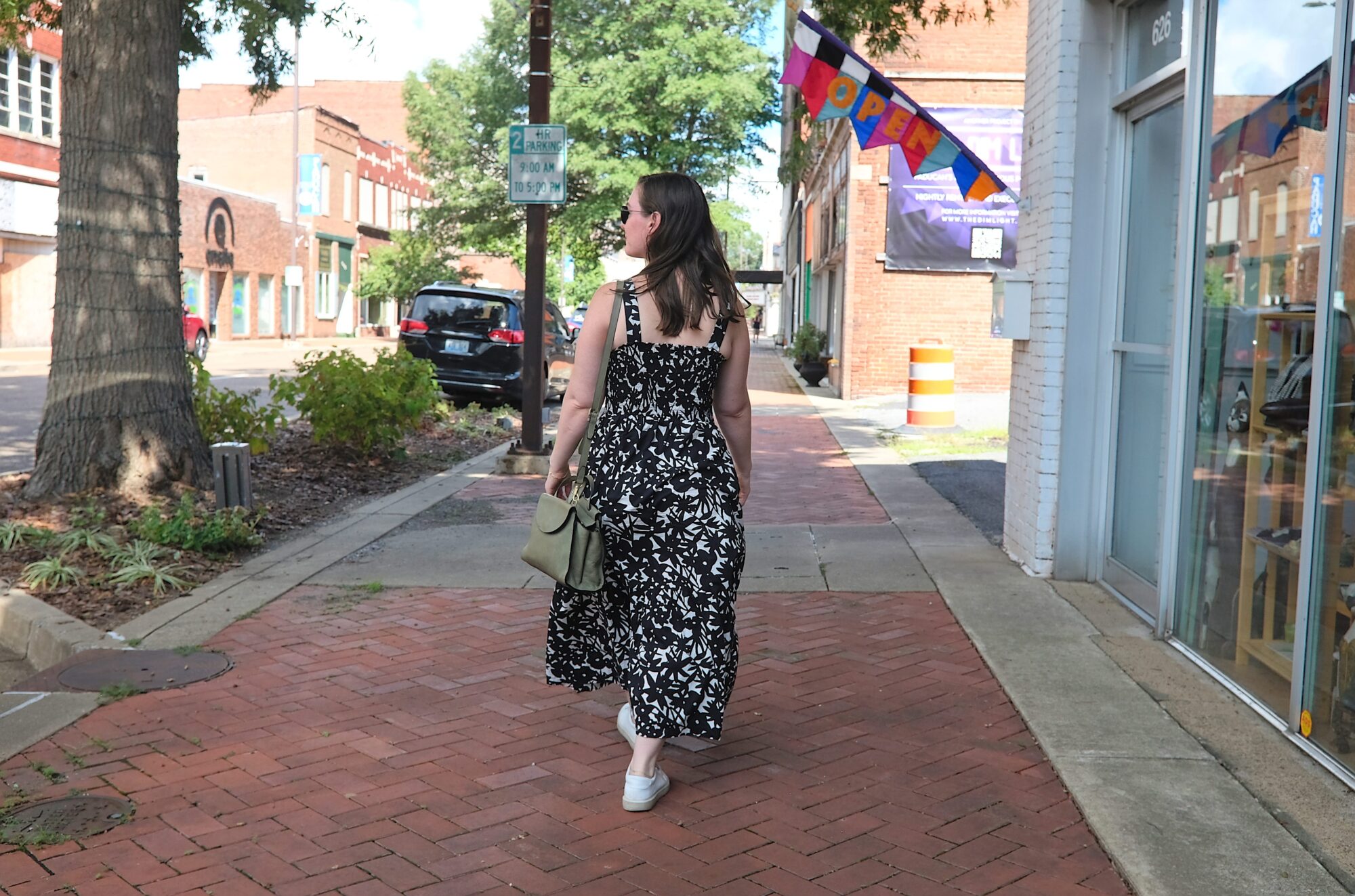 Alyssa walks down a sidewalk in Paducah