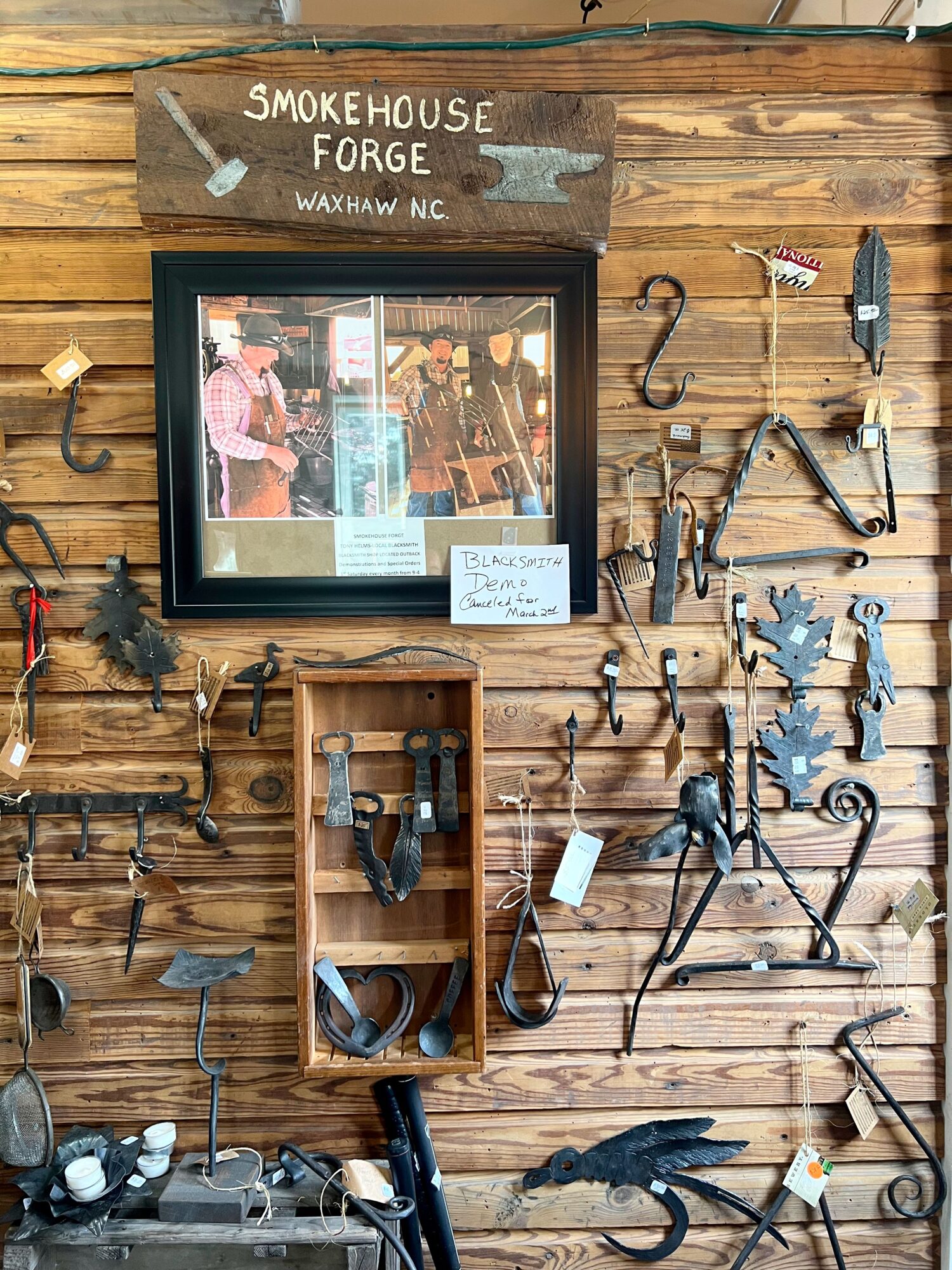 A wall with blacksmith-made items in Waxhaw