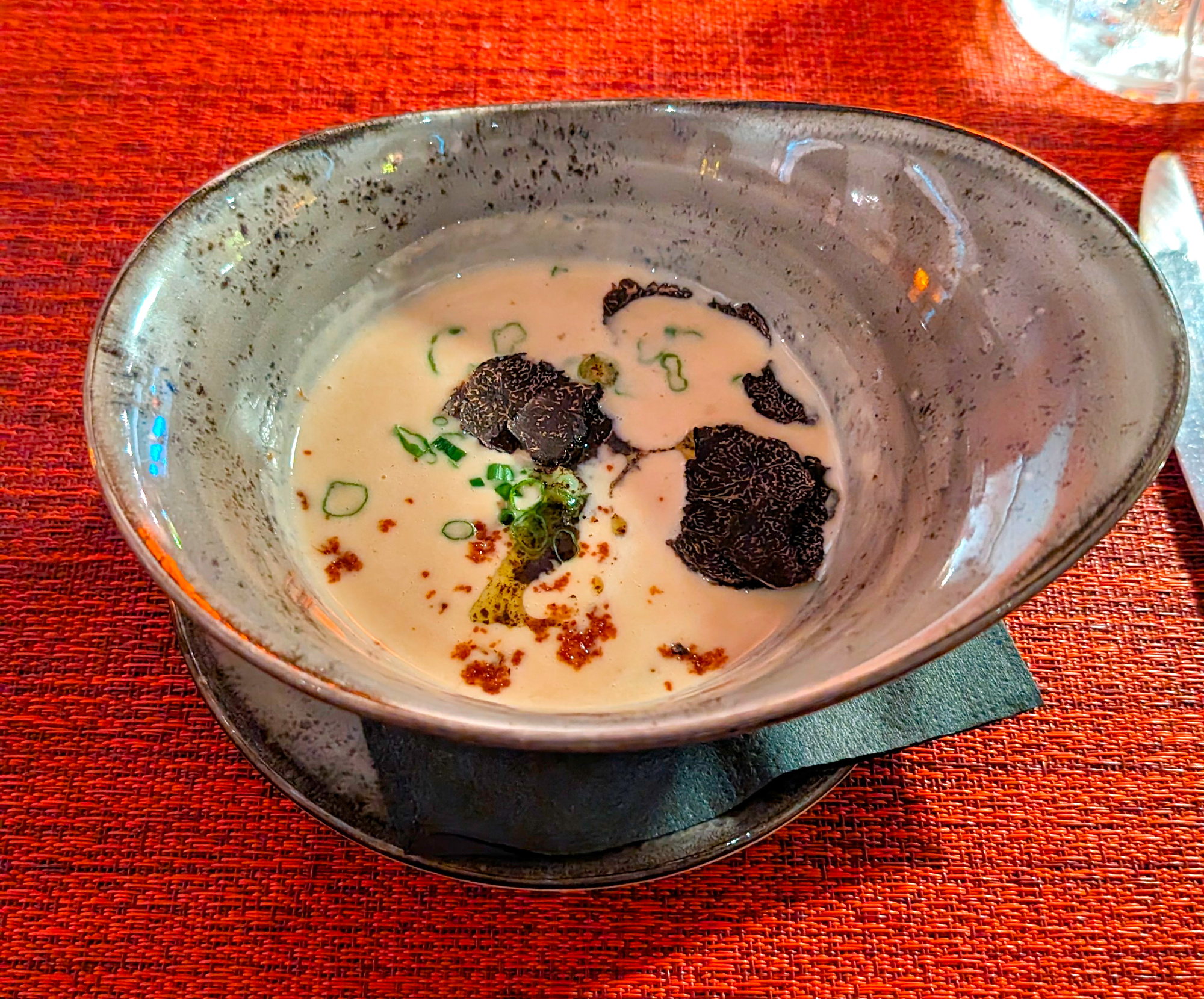 An abstract bowl with Marmalade's famous Tiny White Bean Soup