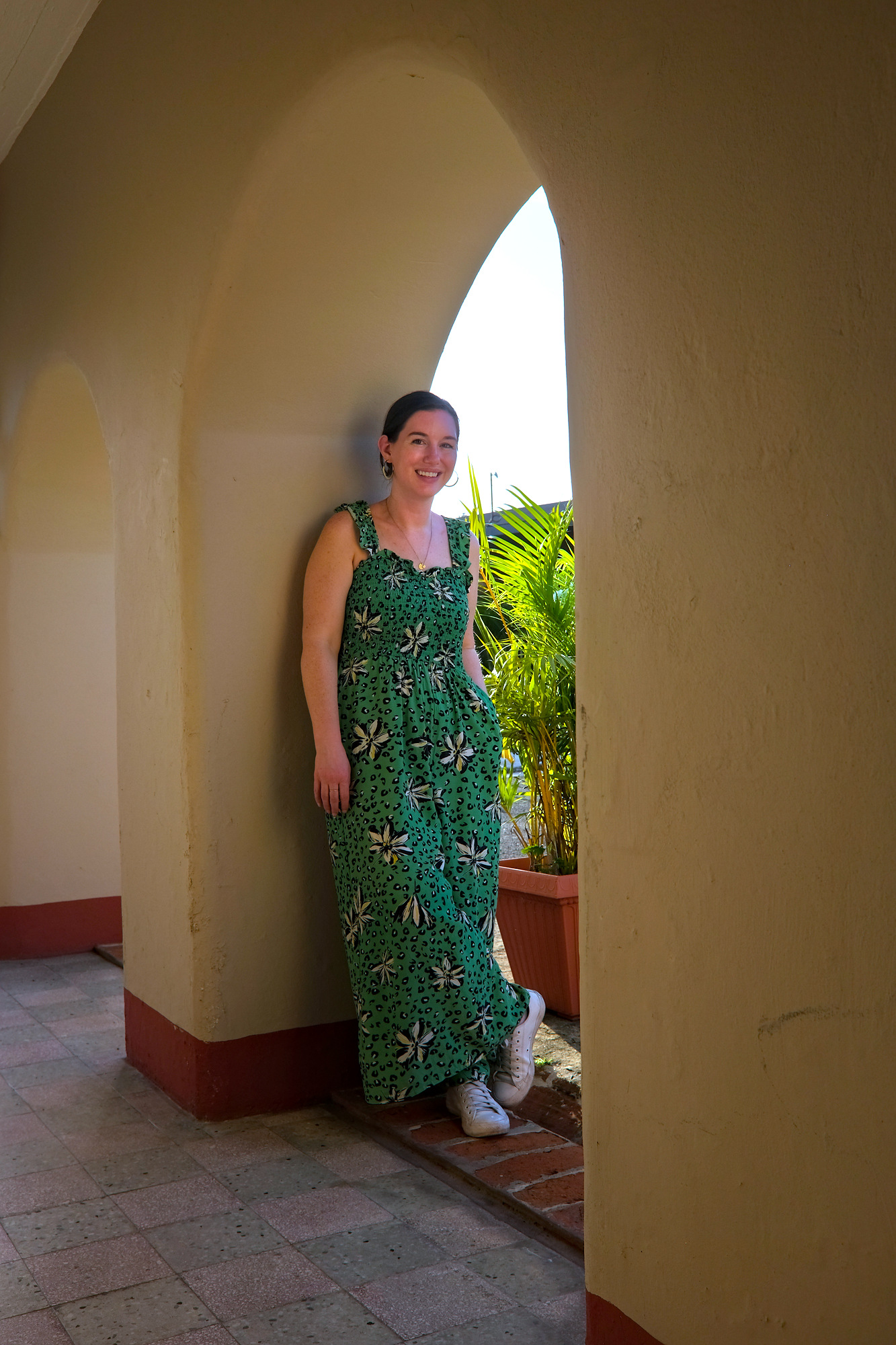 Alyssa leans on an archway at Hacienda Santa Ana