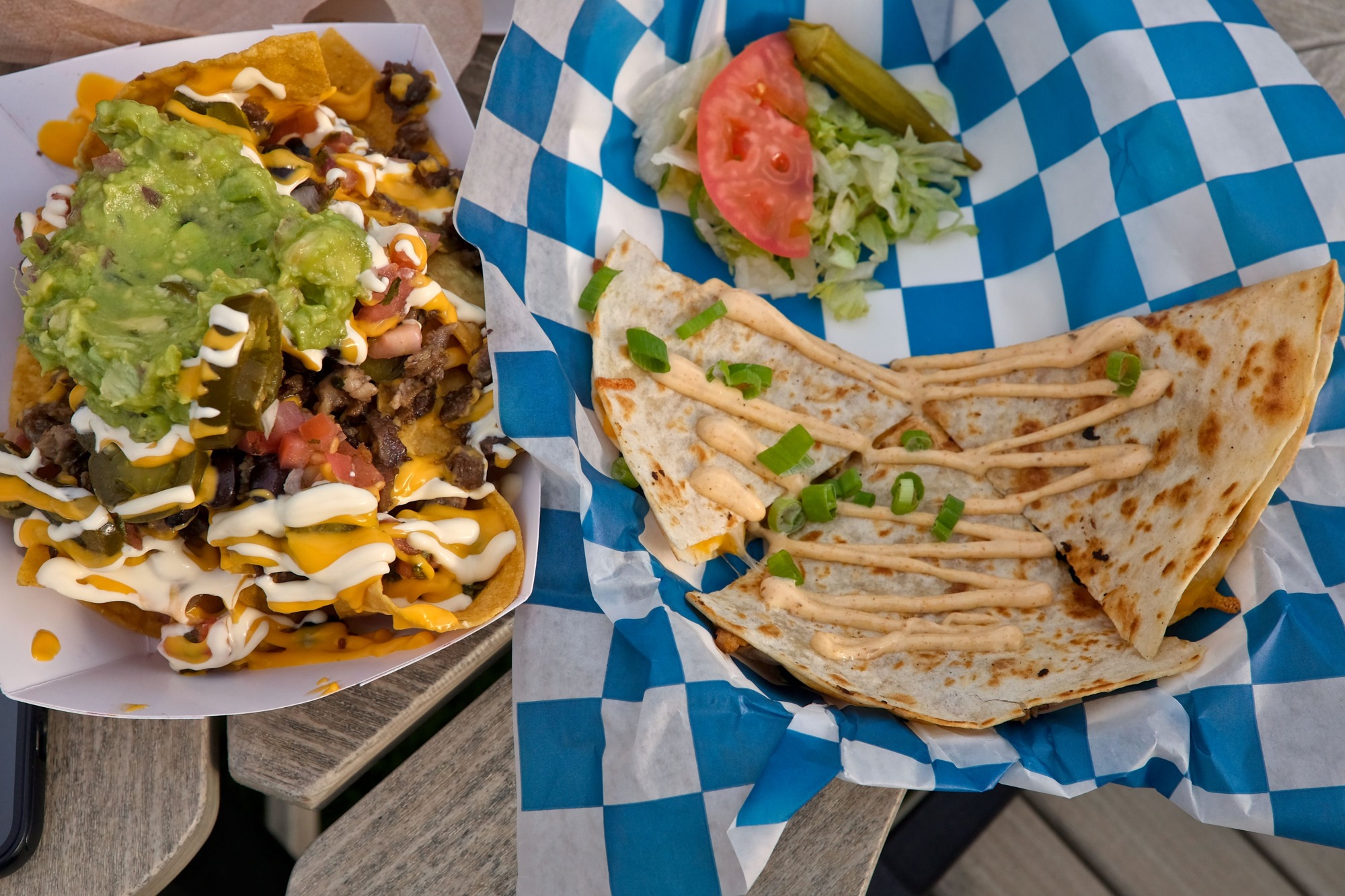 A tray of nachos and a quesadilla