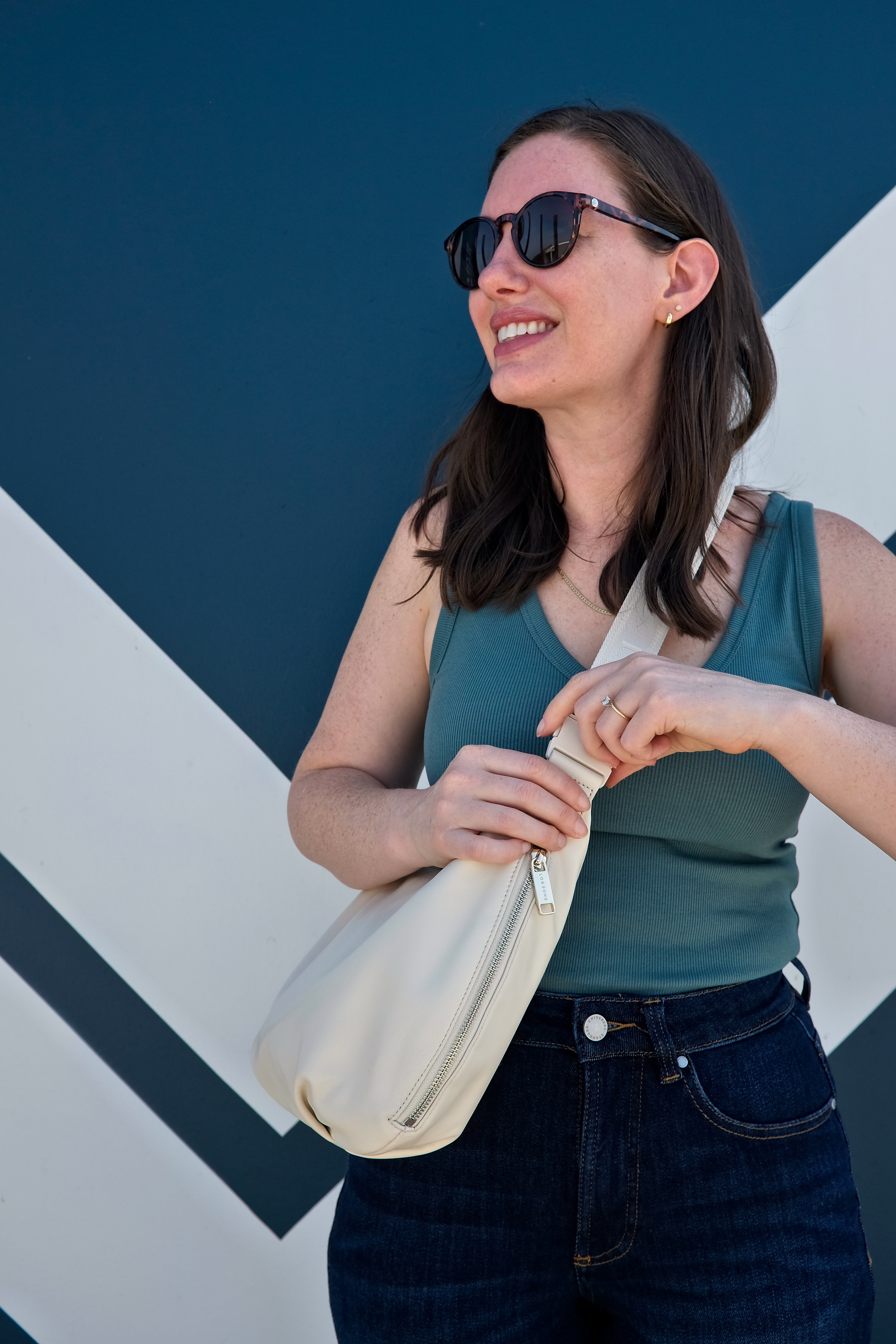 Alyssa pinches the strap on the Aoyama Bag