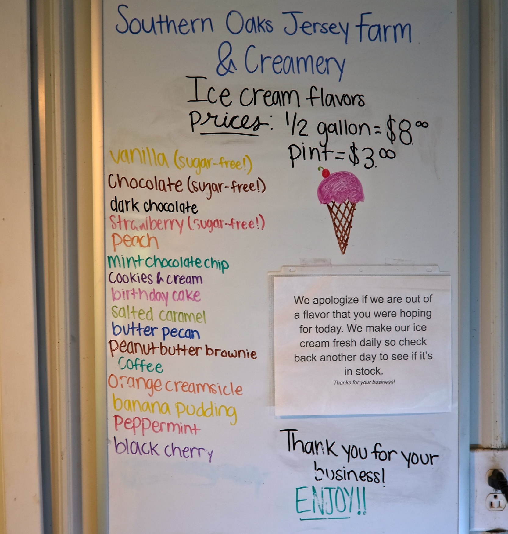 A white board with a list of flavors at Southern Oaks Jerseys, Farm & Creamery