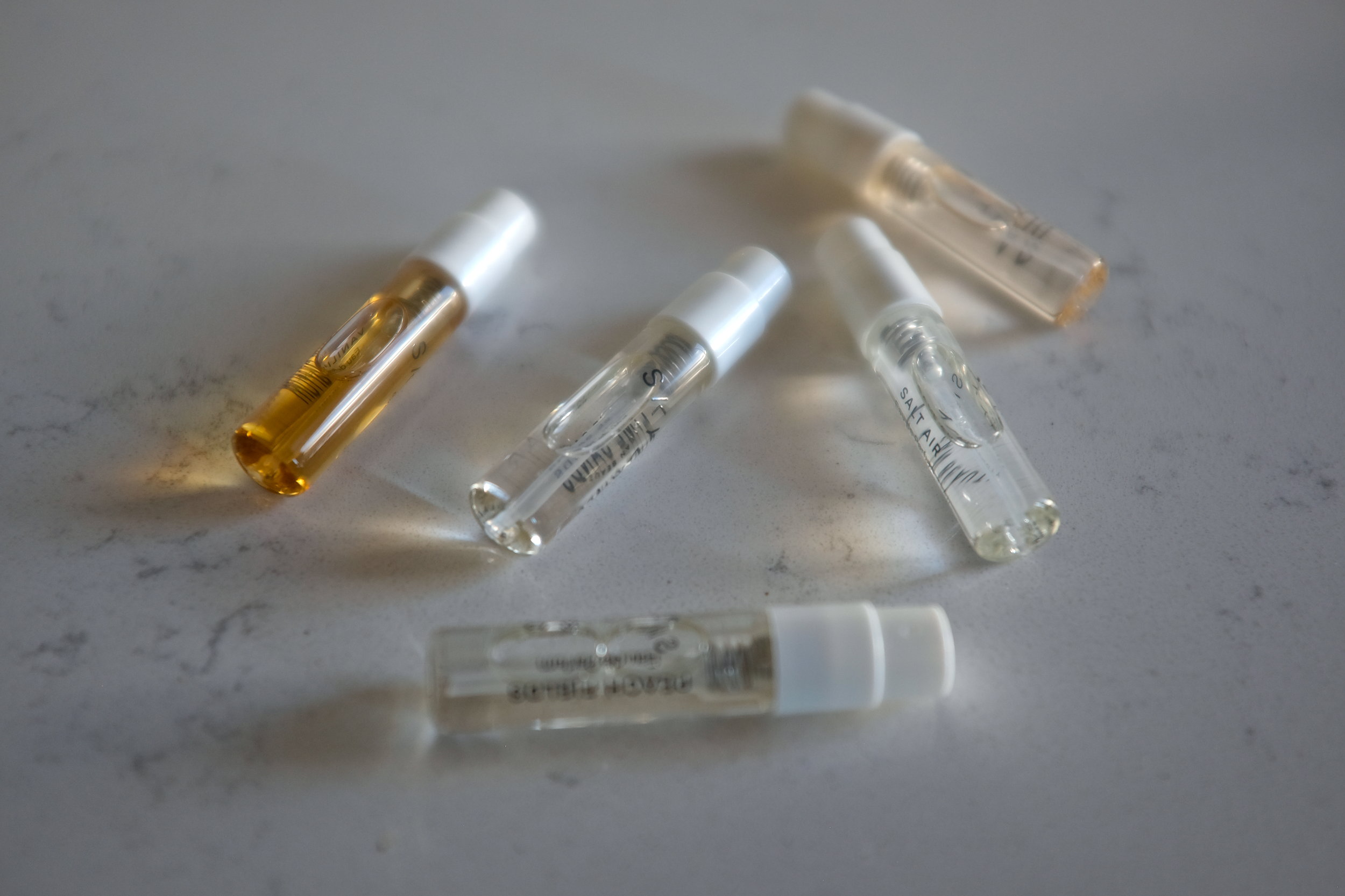 The Skylar fragrances scattered on a counter