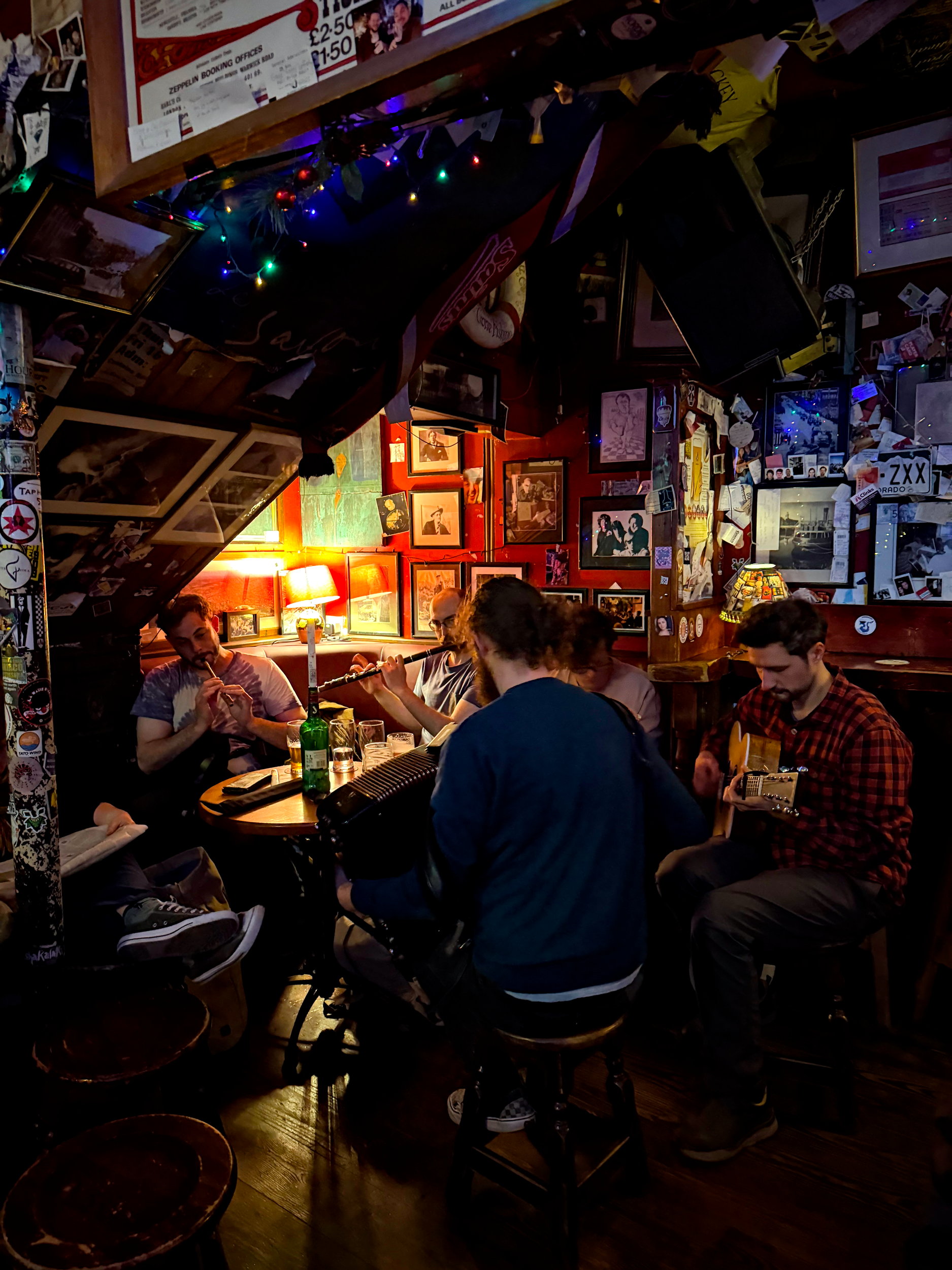 A small group of musicians play traditional Irish music at Sin É