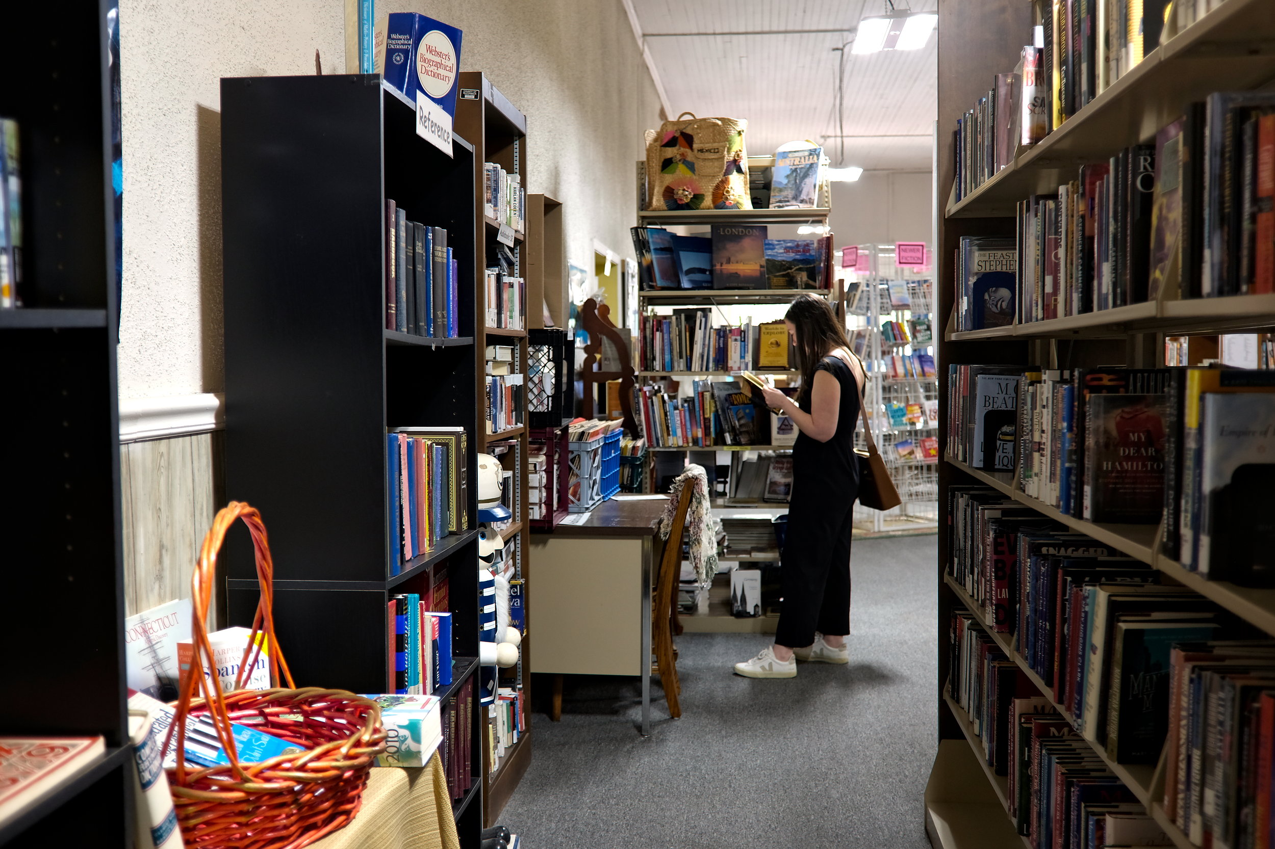 Alyssa looks at a book at Books on Main in McCormick, South Carolina