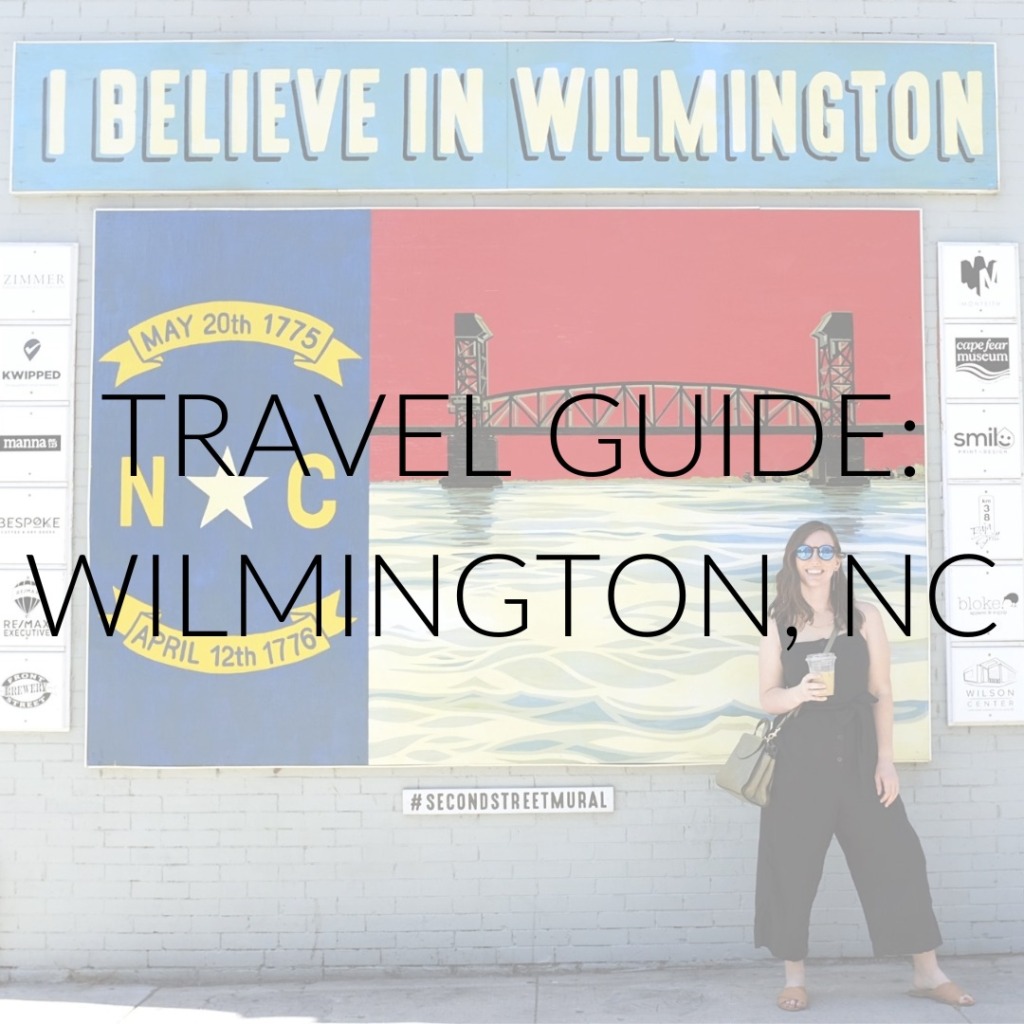 Alyssa in front of a mural in Wilmington, NC with text overlay that reads "Travel Guide: Wilmington, NC"